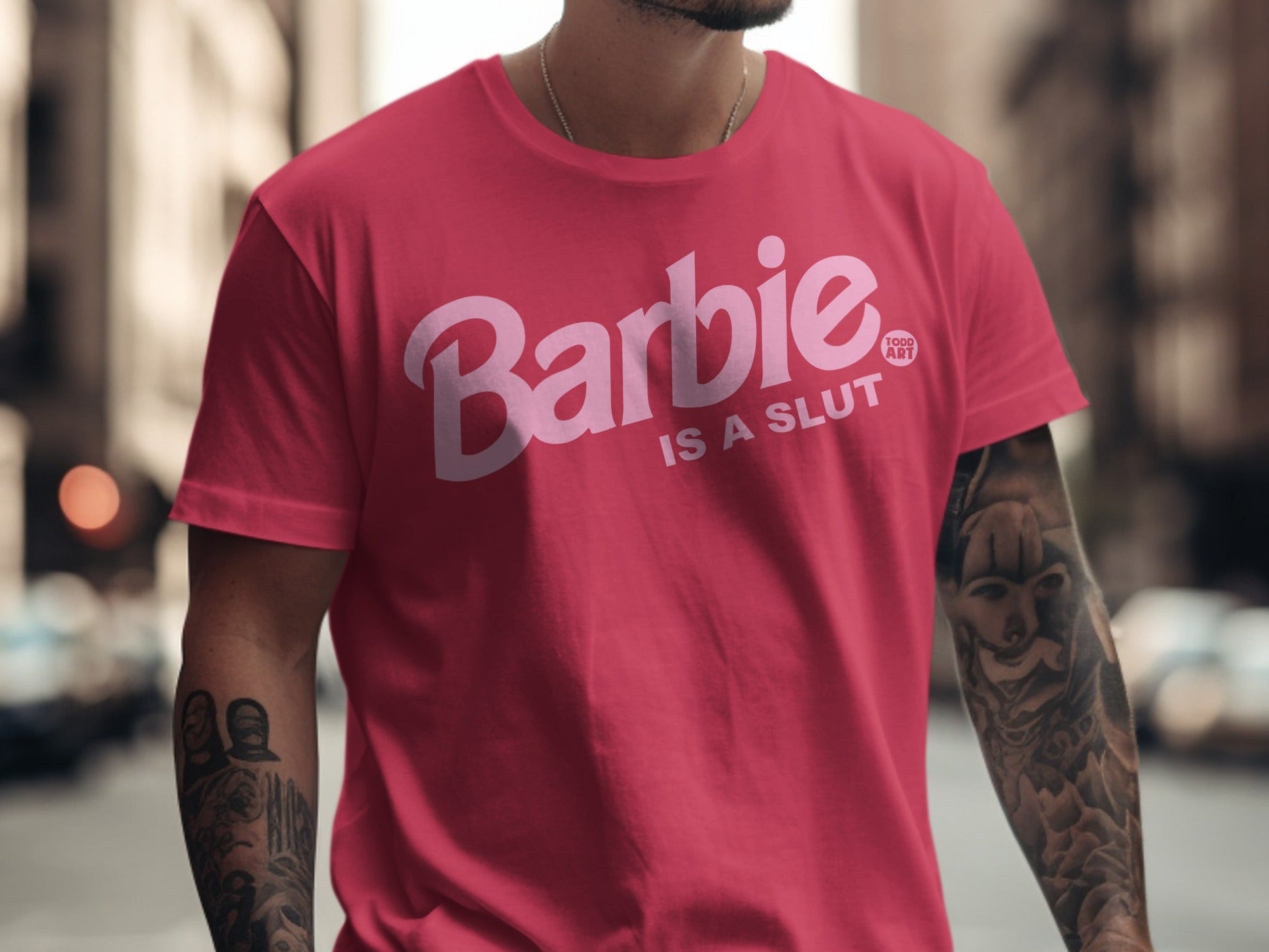 Pink t-shirt with "Barbie IS A SLUT" text and Barbie logo.