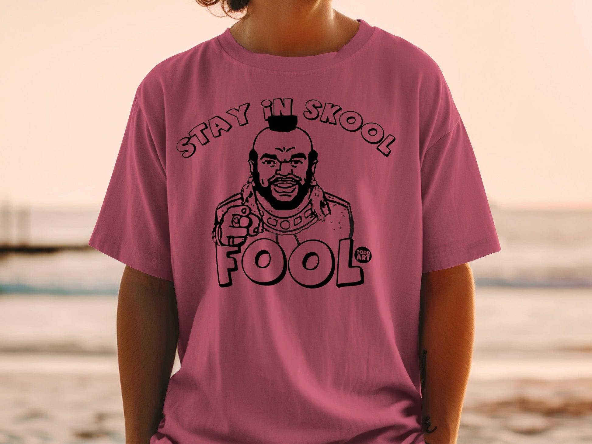 Pink t-shirt featuring Mr. T with "STAY IN SKOOL FOOL" text.