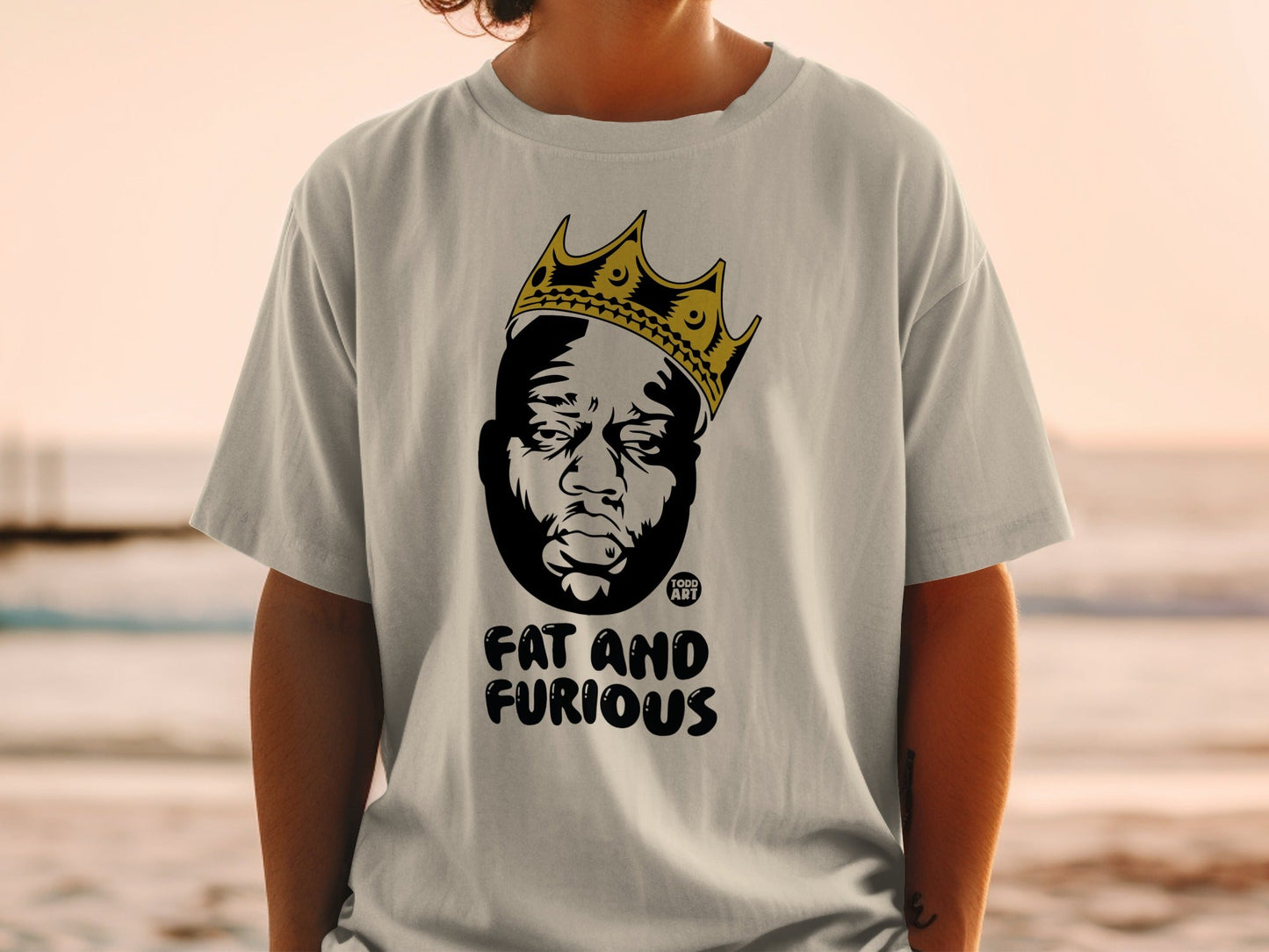 T-shirt with a portrait of a man wearing a crown, "FAT AND FURIOUS" text.