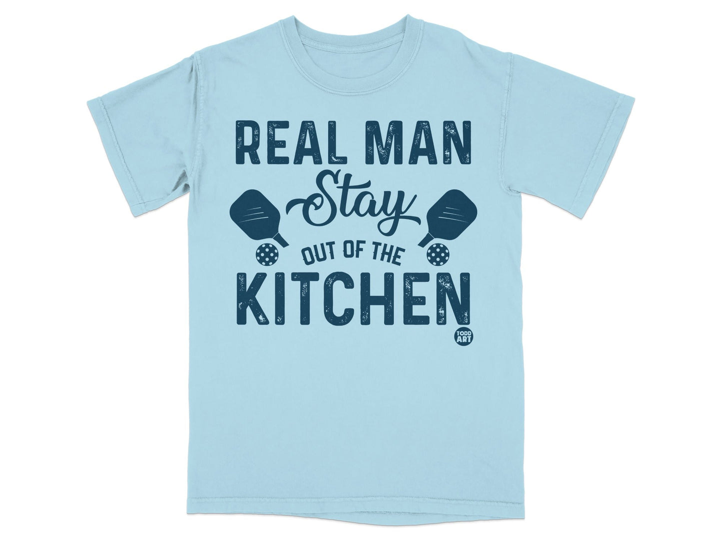 Light blue t-shirt with "Real Man Stay Out of the Kitchen" and pickleball paddles.