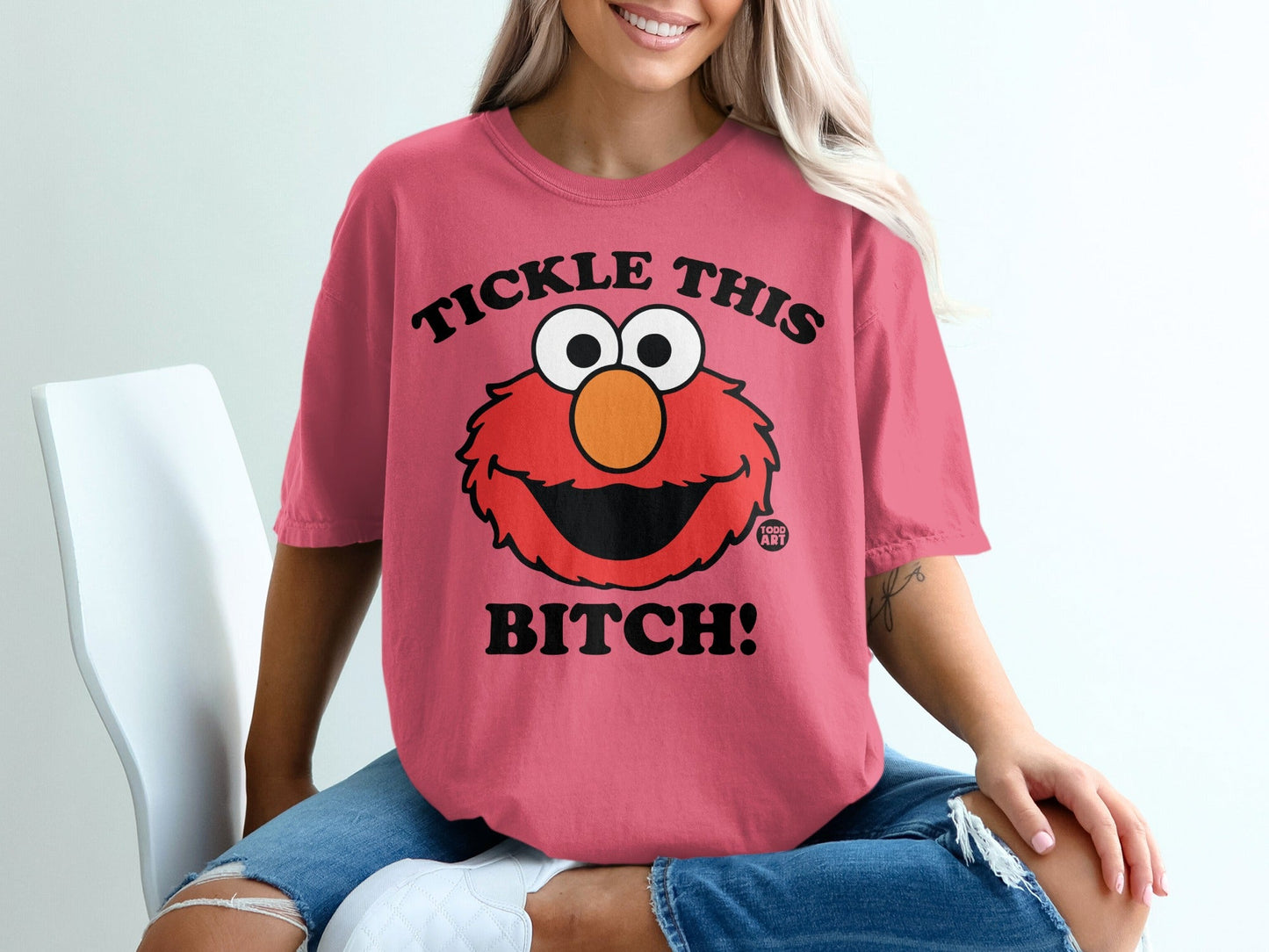 Pink t-shirt with Elmo graphic and "Tickle This Bitch!" text.