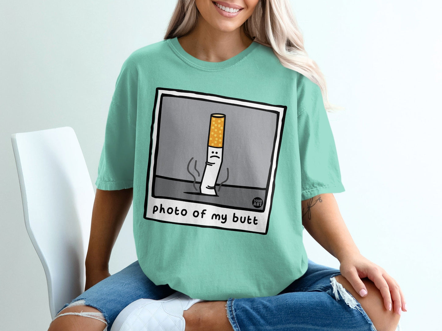 T-shirt with cartoon cigarette saying "photo of my butt".