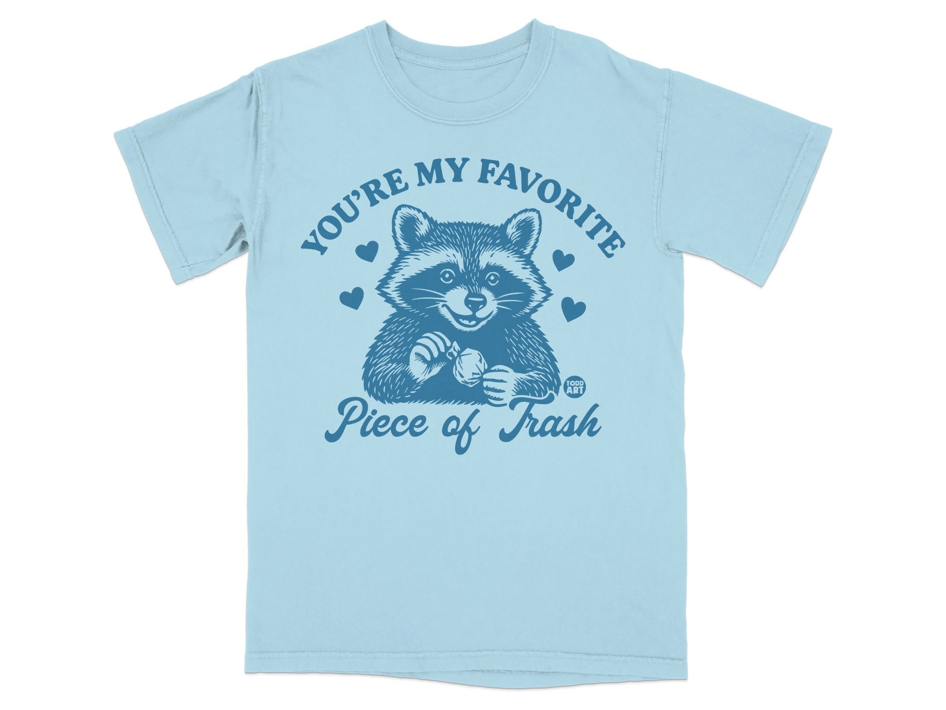 Light blue t-shirt with a raccoon and "You're my favorite piece of trash" text.