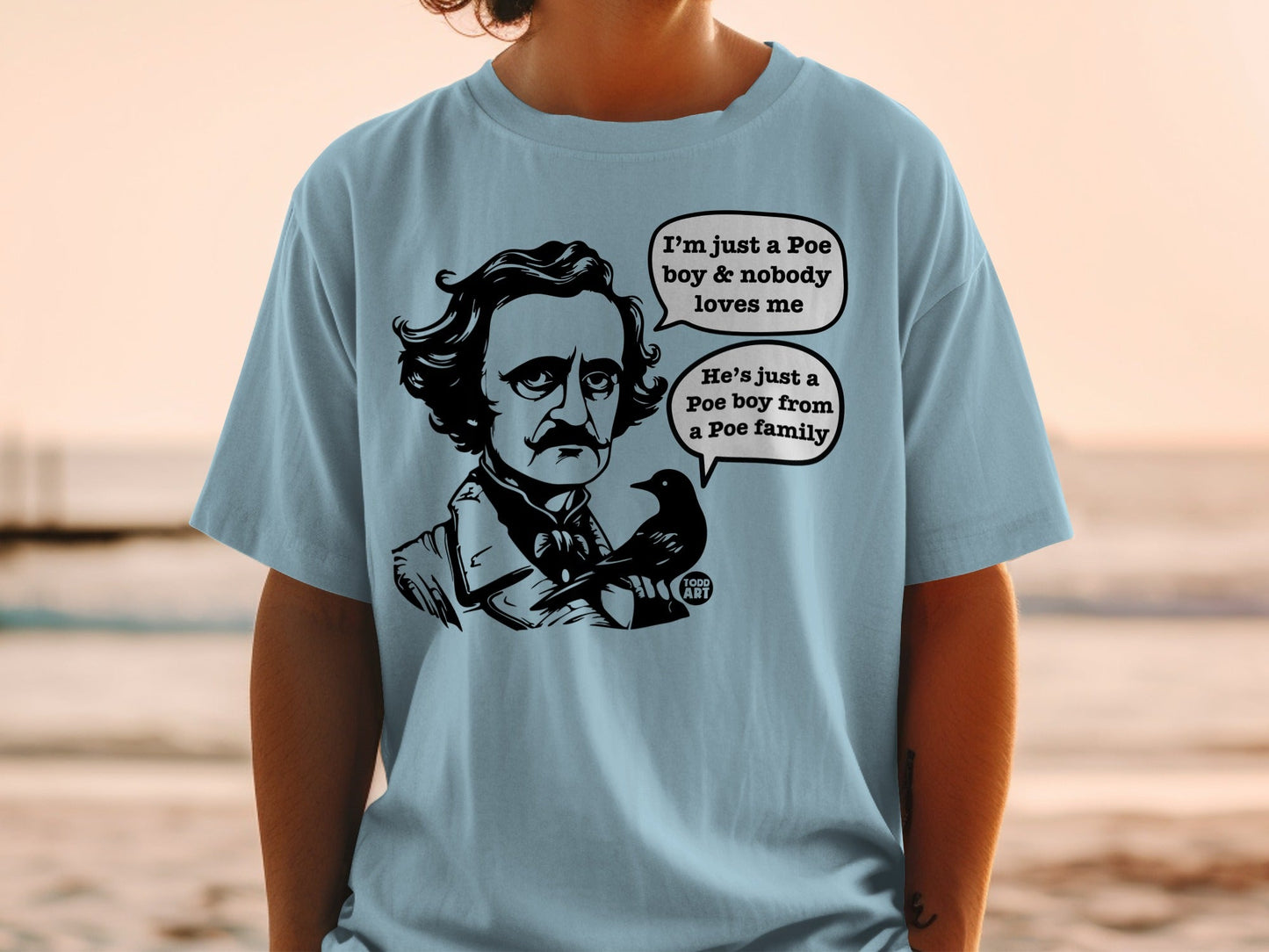 Light blue t-shirt with Edgar Allan Poe and a raven, text about a Poe boy.