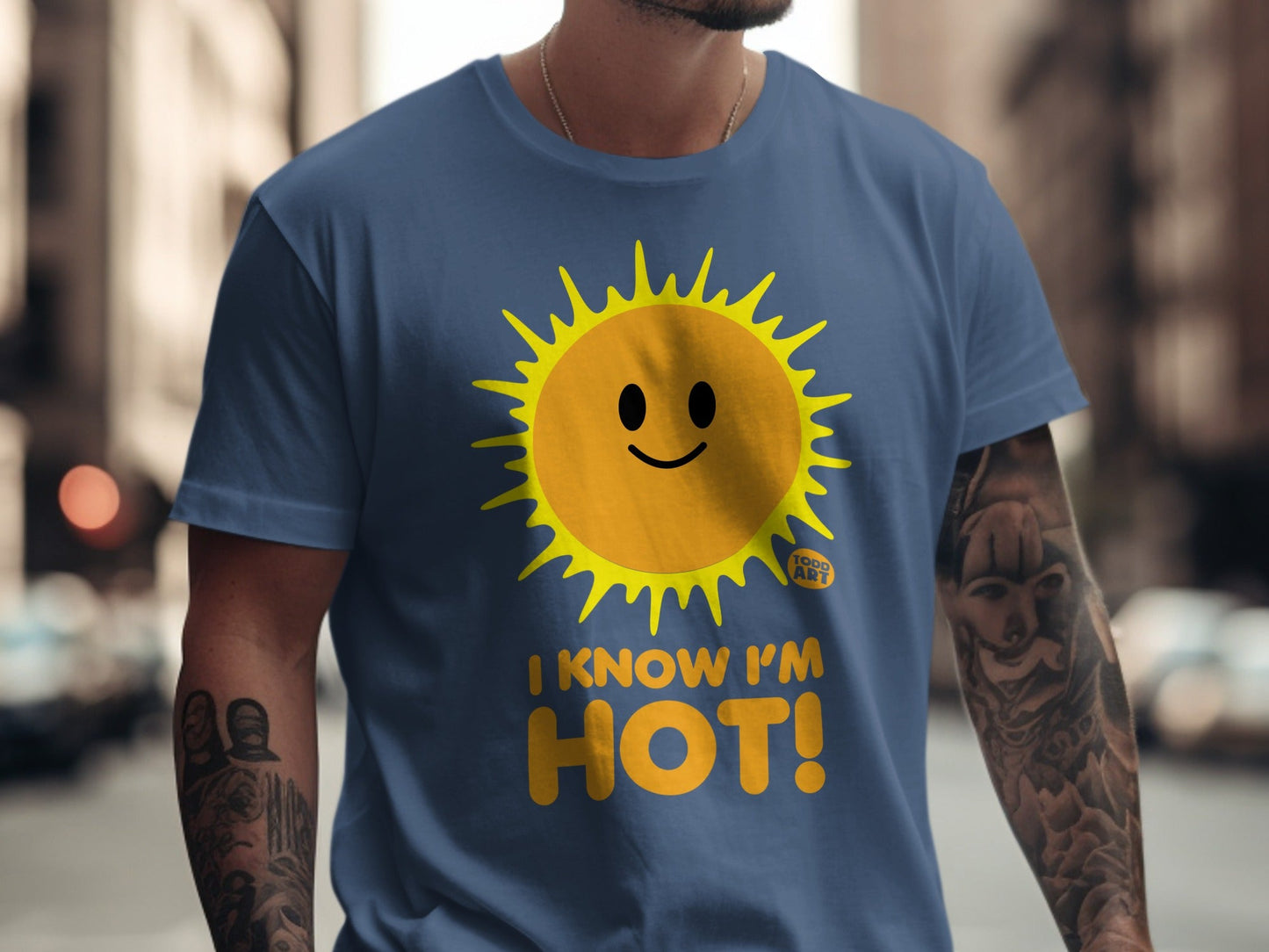 Blue t-shirt with a smiling sun graphic and the text "I KNOW I'M HOT!".