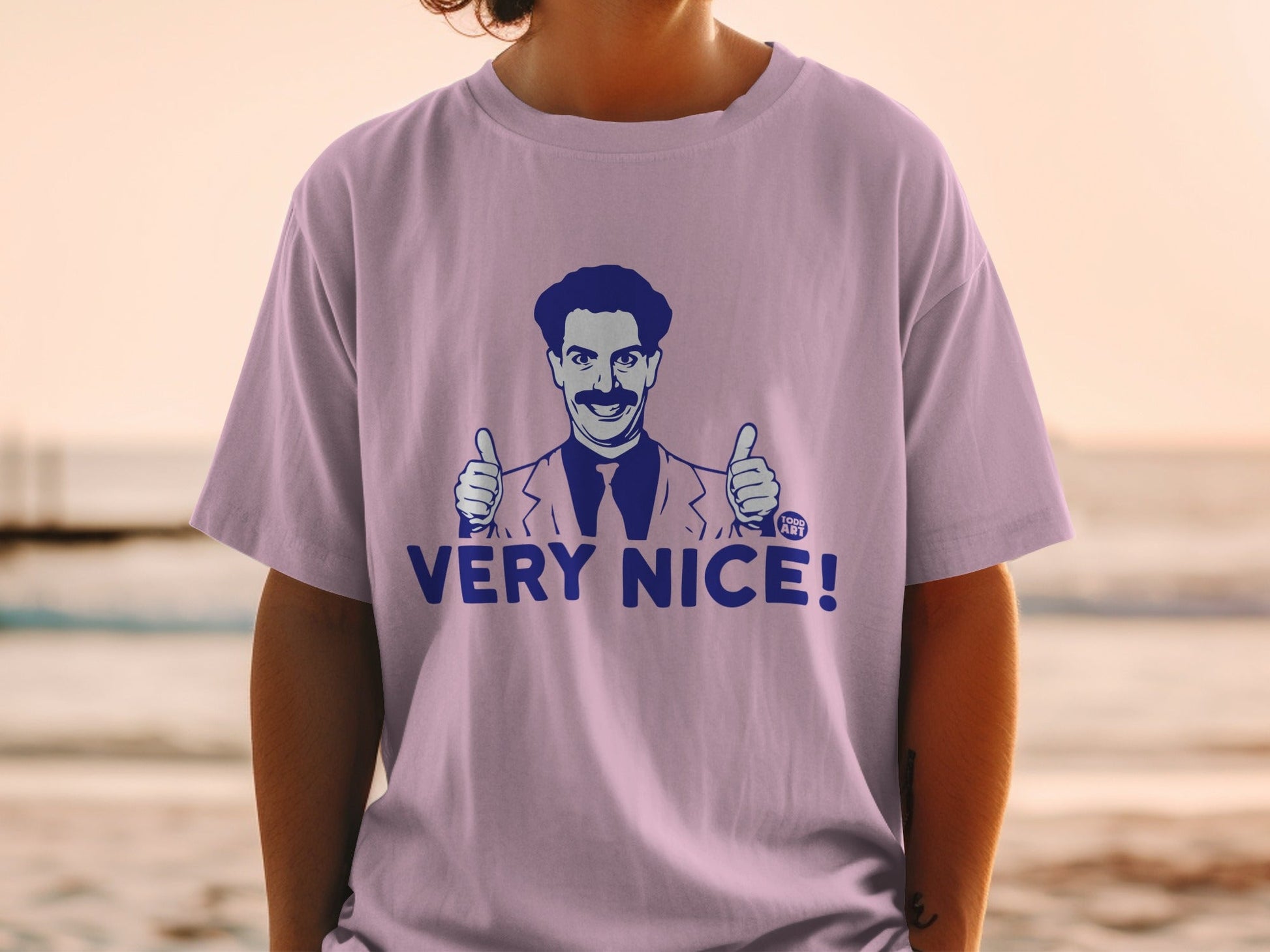 T-shirt with Borat character giving two thumbs up and "VERY NICE!" text.