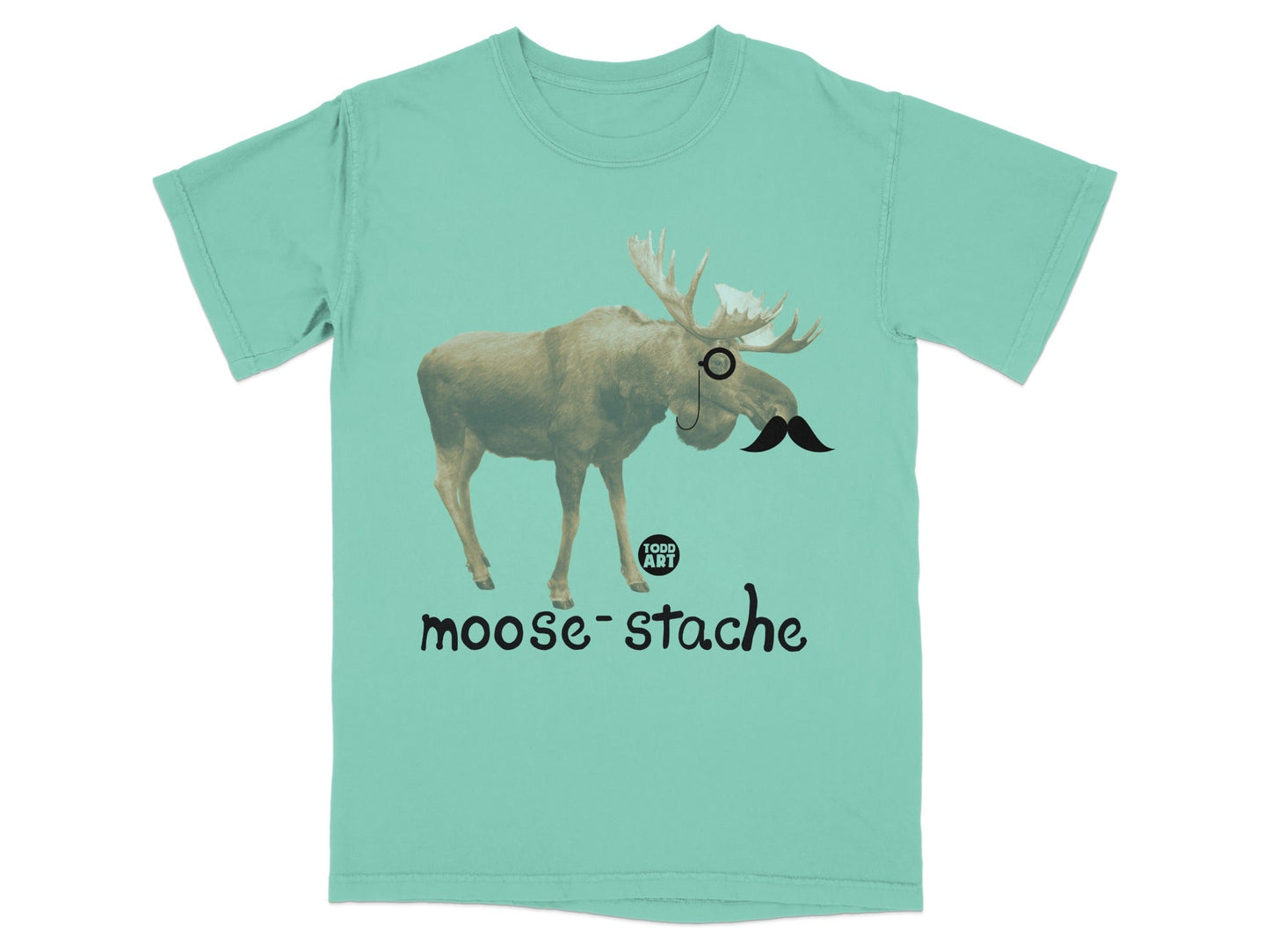 Mint t-shirt with a moose wearing a monocle and mustache, text reads "moose-stache".
