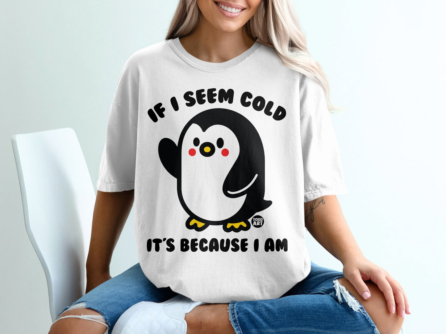 T-shirt with cartoon penguin and text "If I seem cold it's because I am".