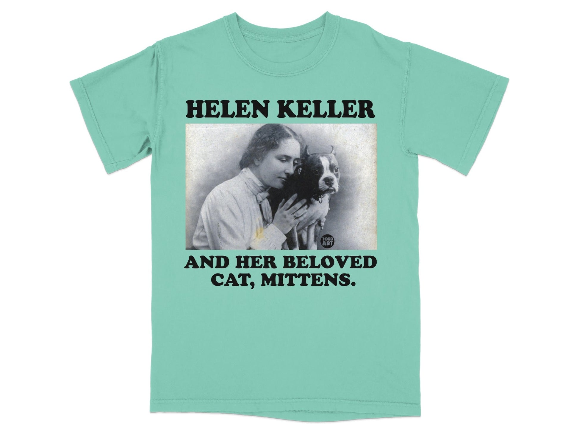 Helen Keller and her cat Mittens on a mint green t-shirt.