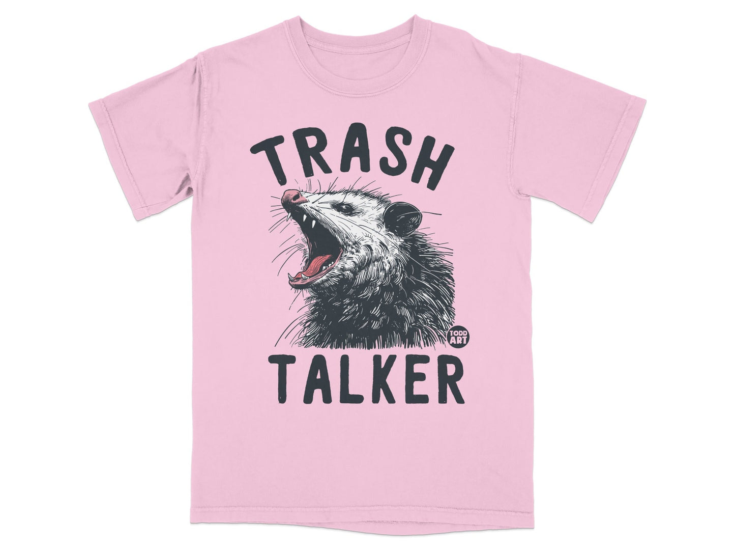 Pink t-shirt with a graphic of a possum and the text "TRASH TALKER".