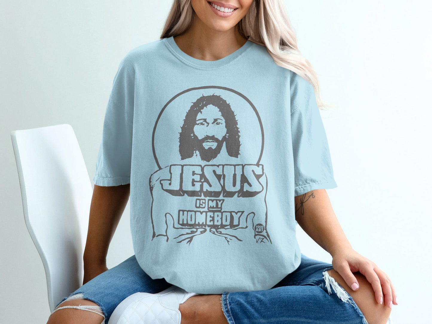 Light blue t-shirt with graphic of Jesus and text "JESUS IS MY HOMEBOY".