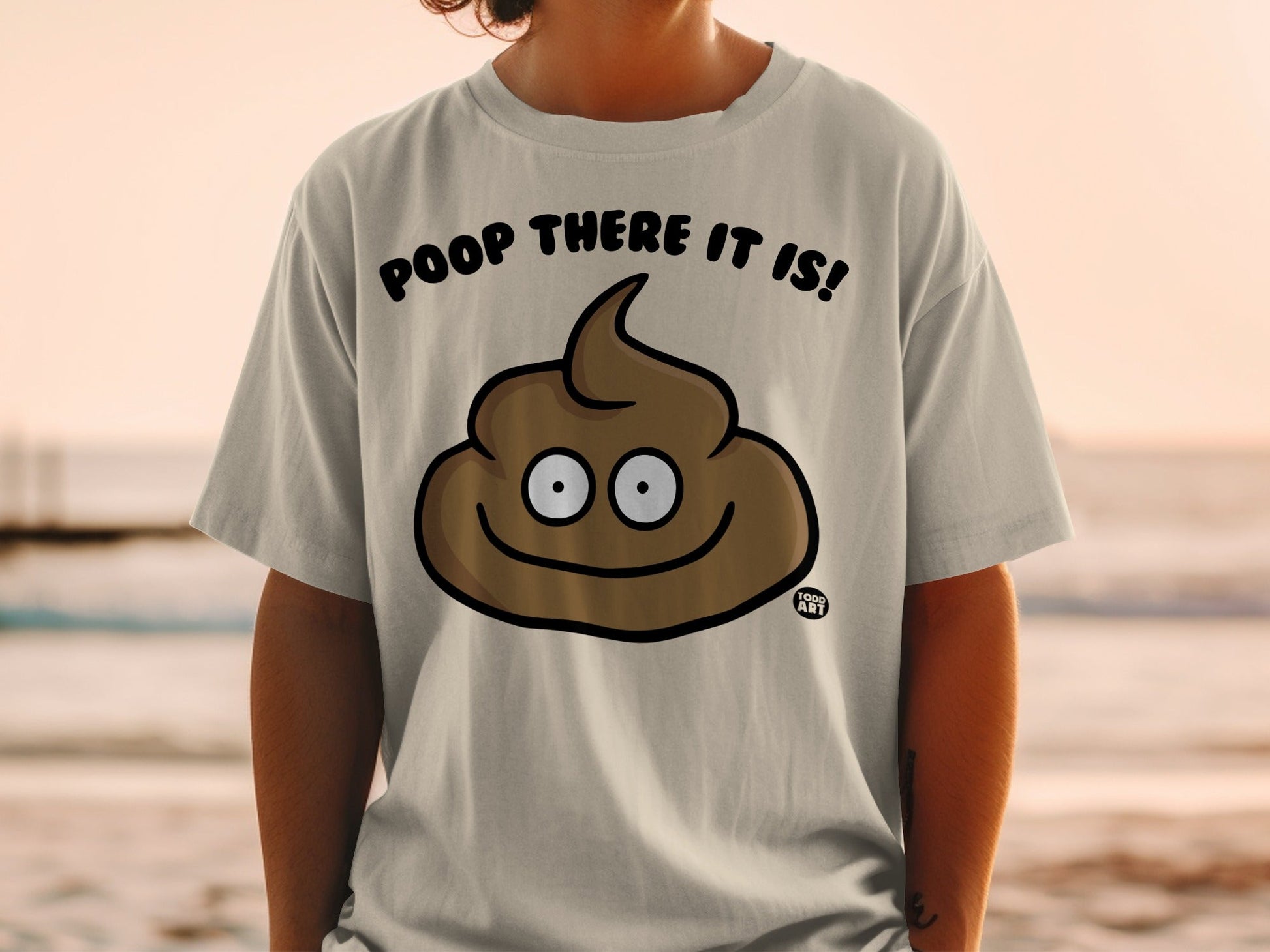 T-shirt with cartoon poop emoji and text "POOP THERE IT IS!".