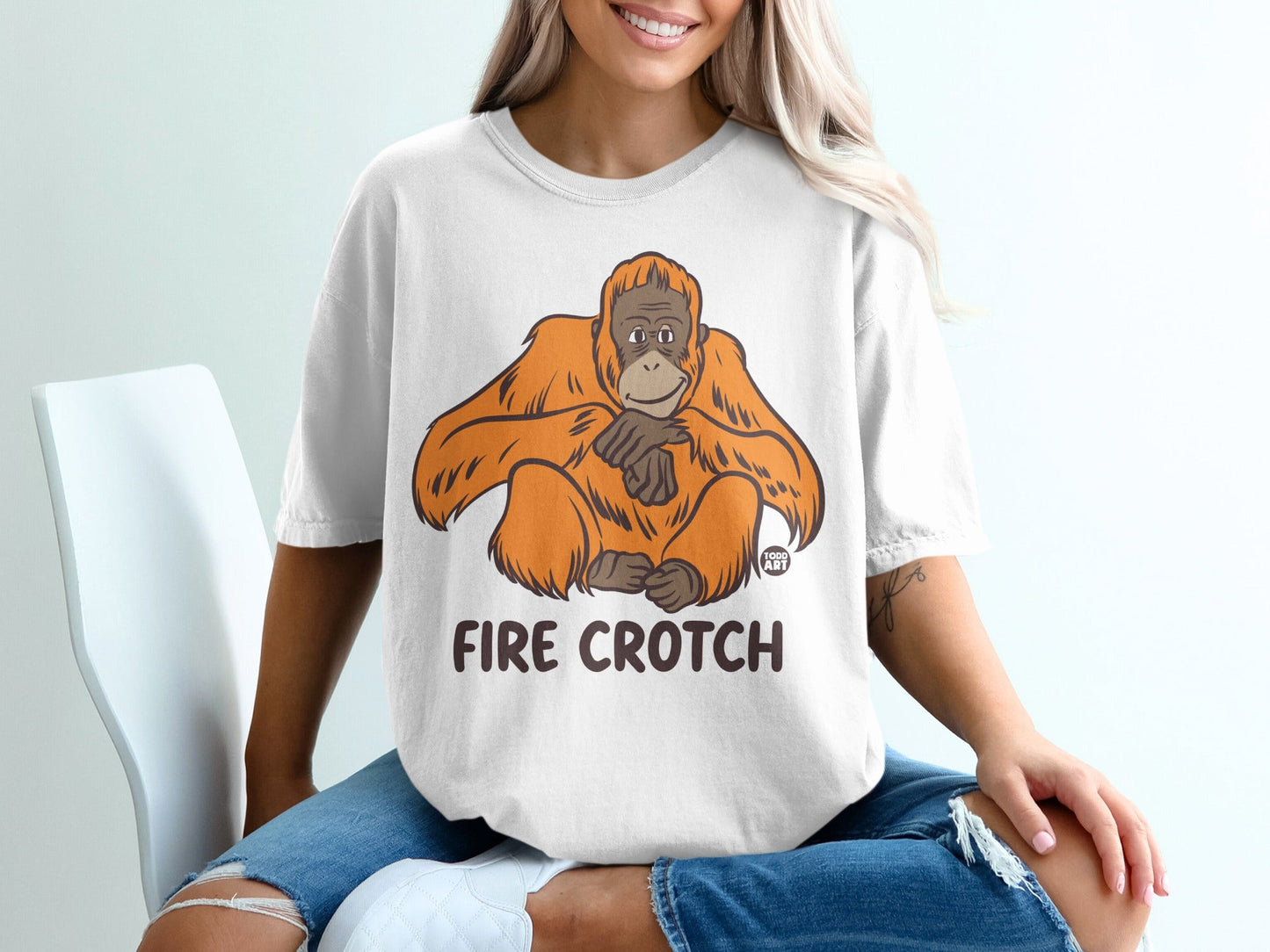 T-shirt with cartoon orangutan and "FIRE CROTCH" text.