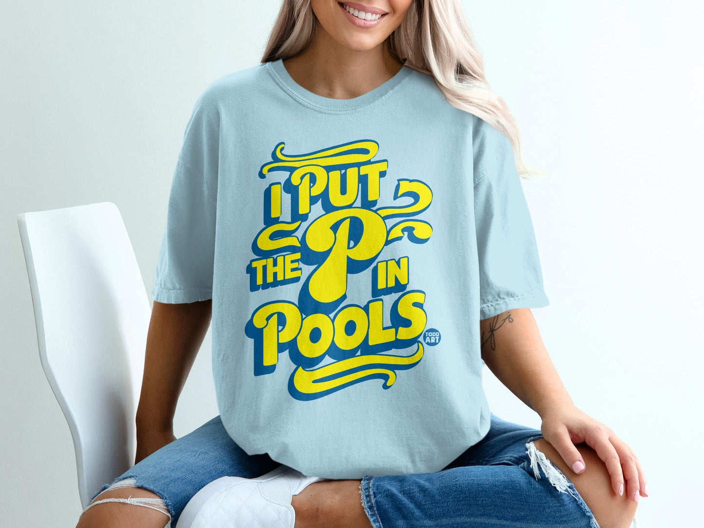 Light blue t-shirt with yellow and blue "I PUT THE P IN POOLS" text.