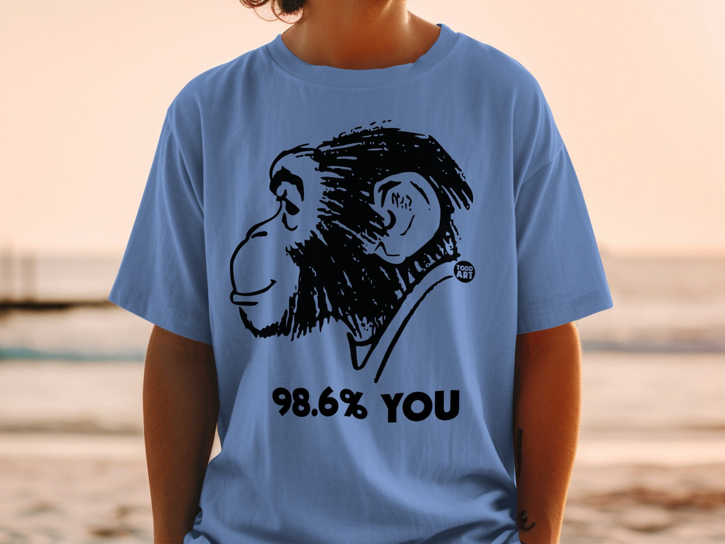 Blue t-shirt with black monkey graphic and "98.6% YOU" text.