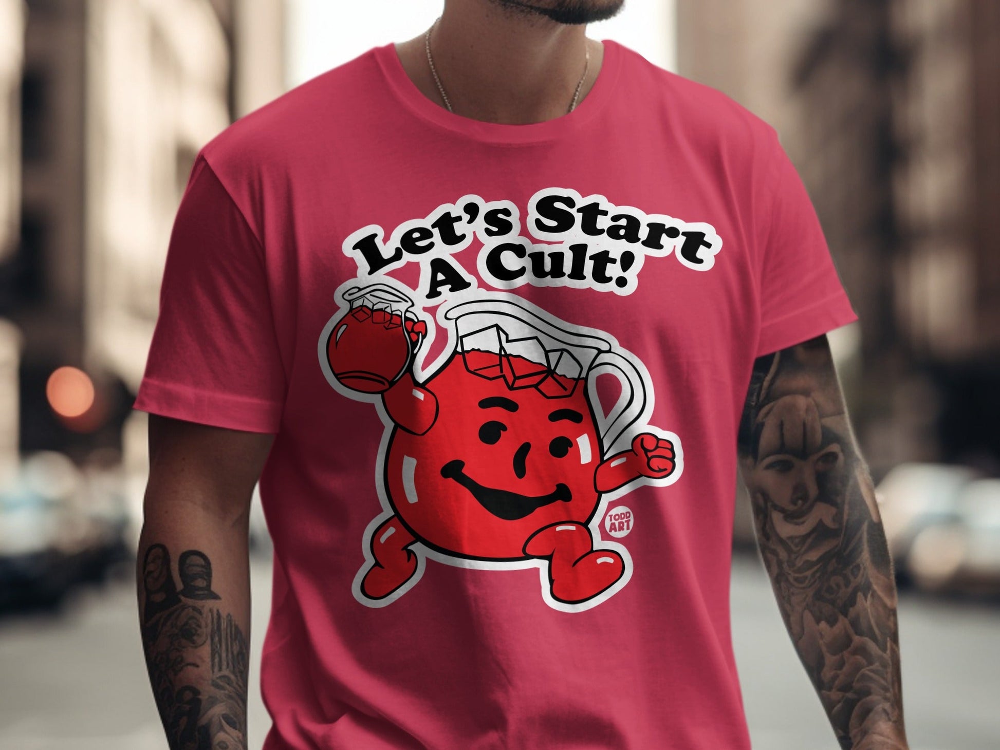 Kool-Aid Man on red t-shirt with "Let's Start a Cult!" text.