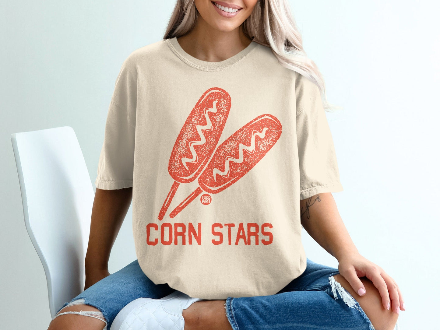 Cream t-shirt with two corn dogs and "CORN STARS" text.