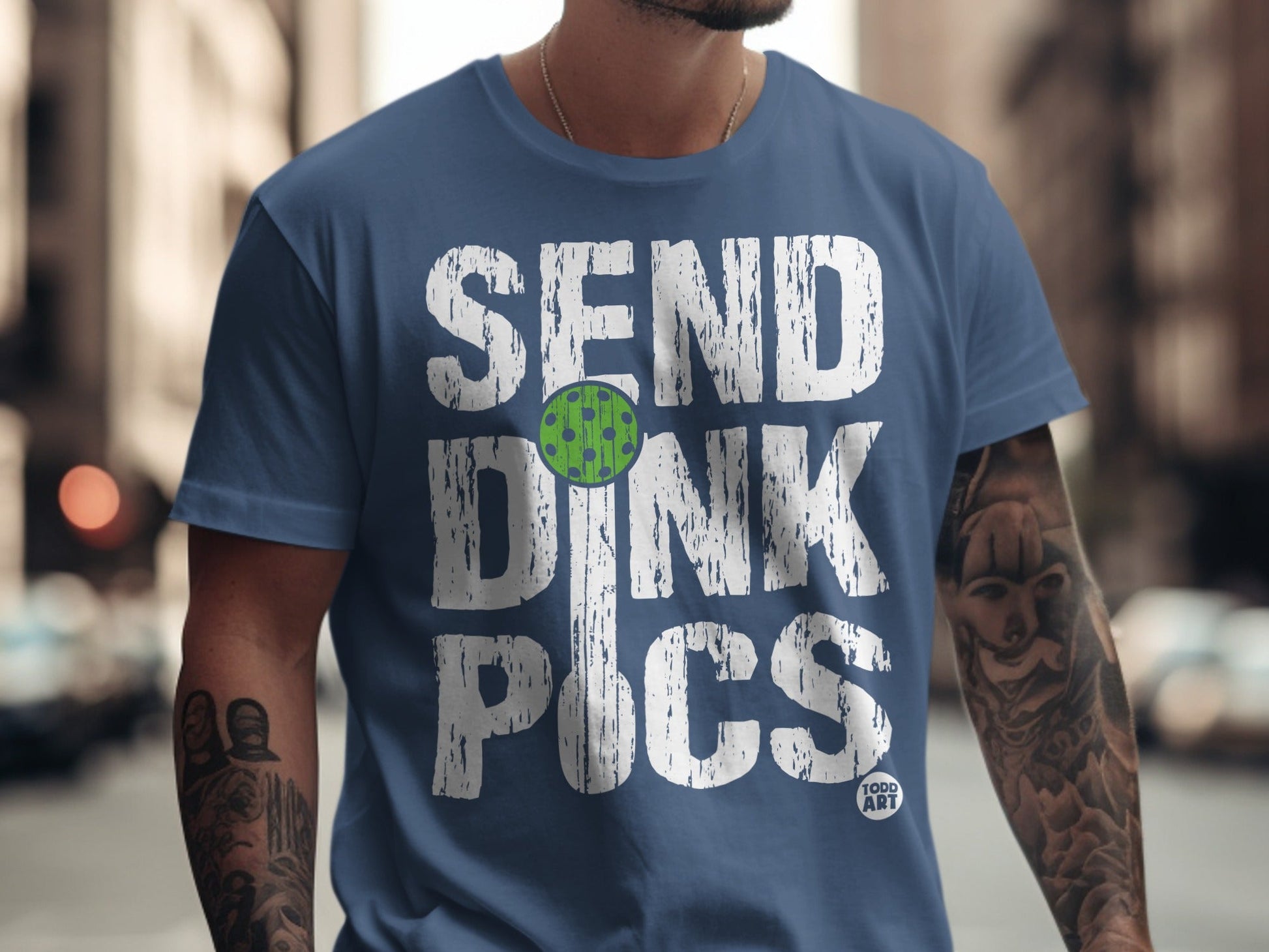 Navy t-shirt with "SEND DINK PICS" and a pickleball graphic.