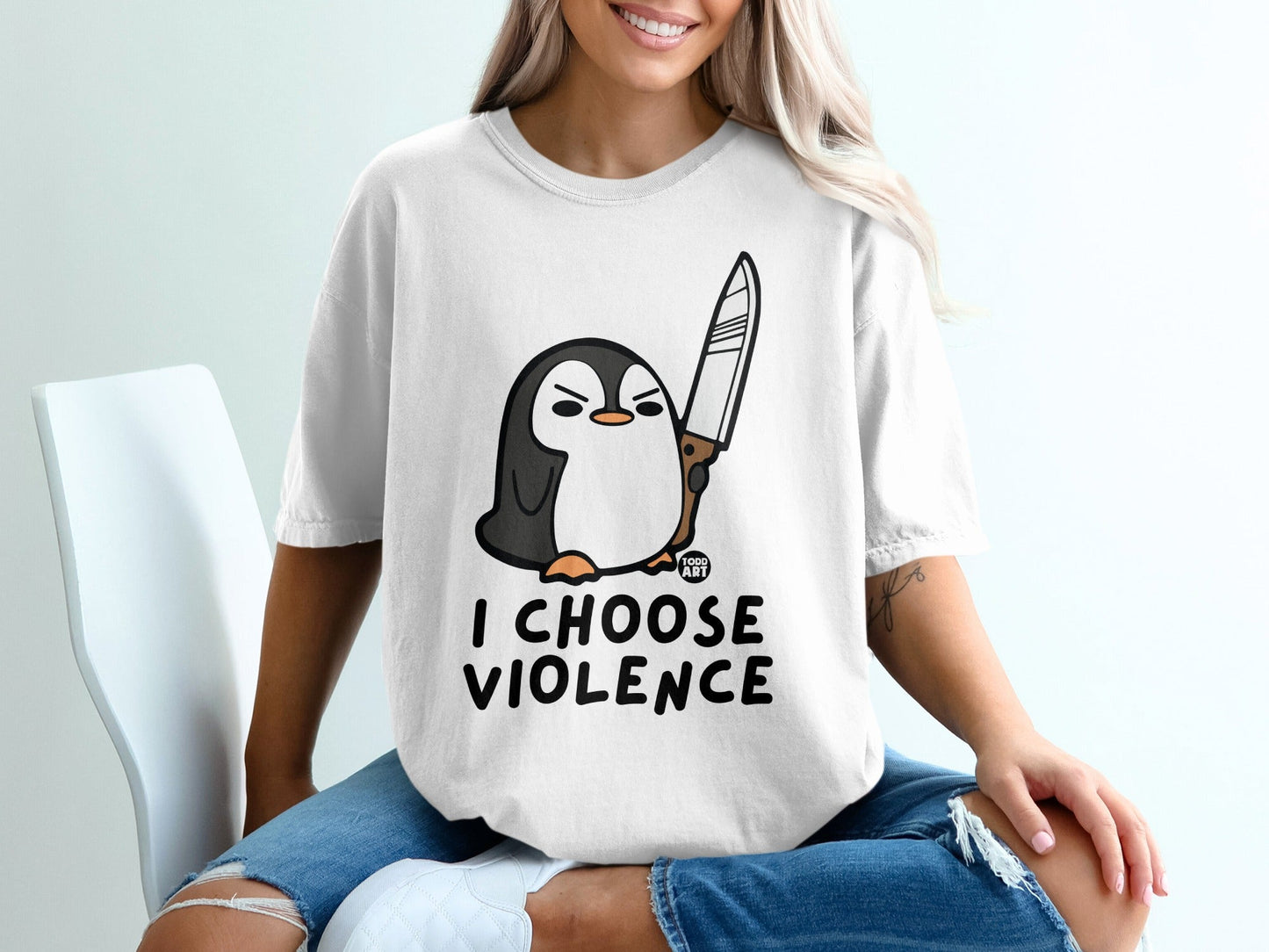T-shirt with a penguin holding a knife, text "I CHOOSE VIOLENCE".