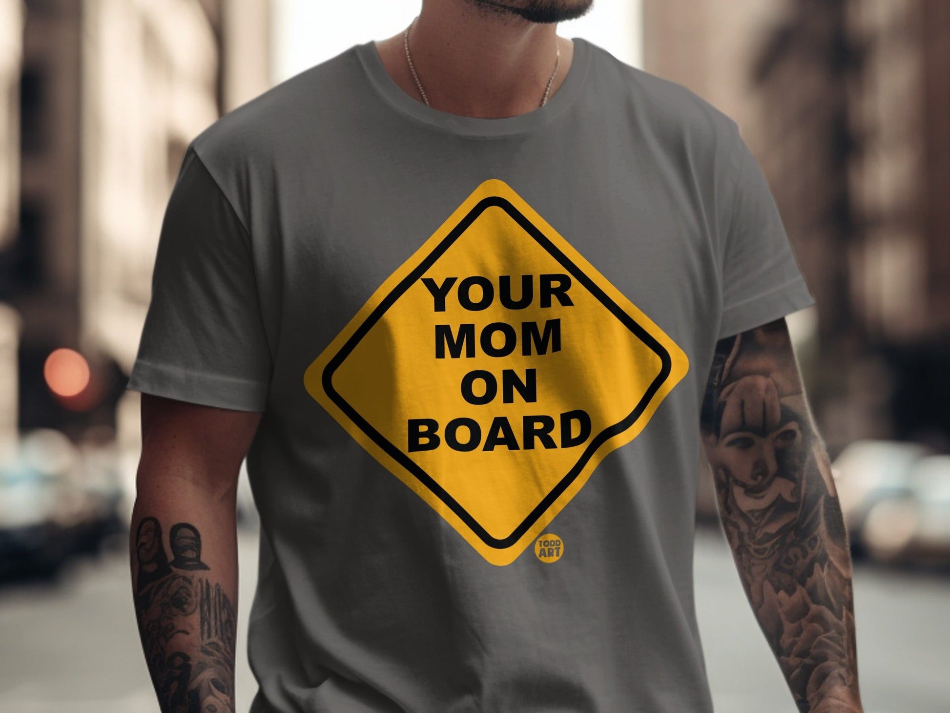 Yellow diamond sign with black text "YOUR MOM ON BOARD" on a gray t-shirt.