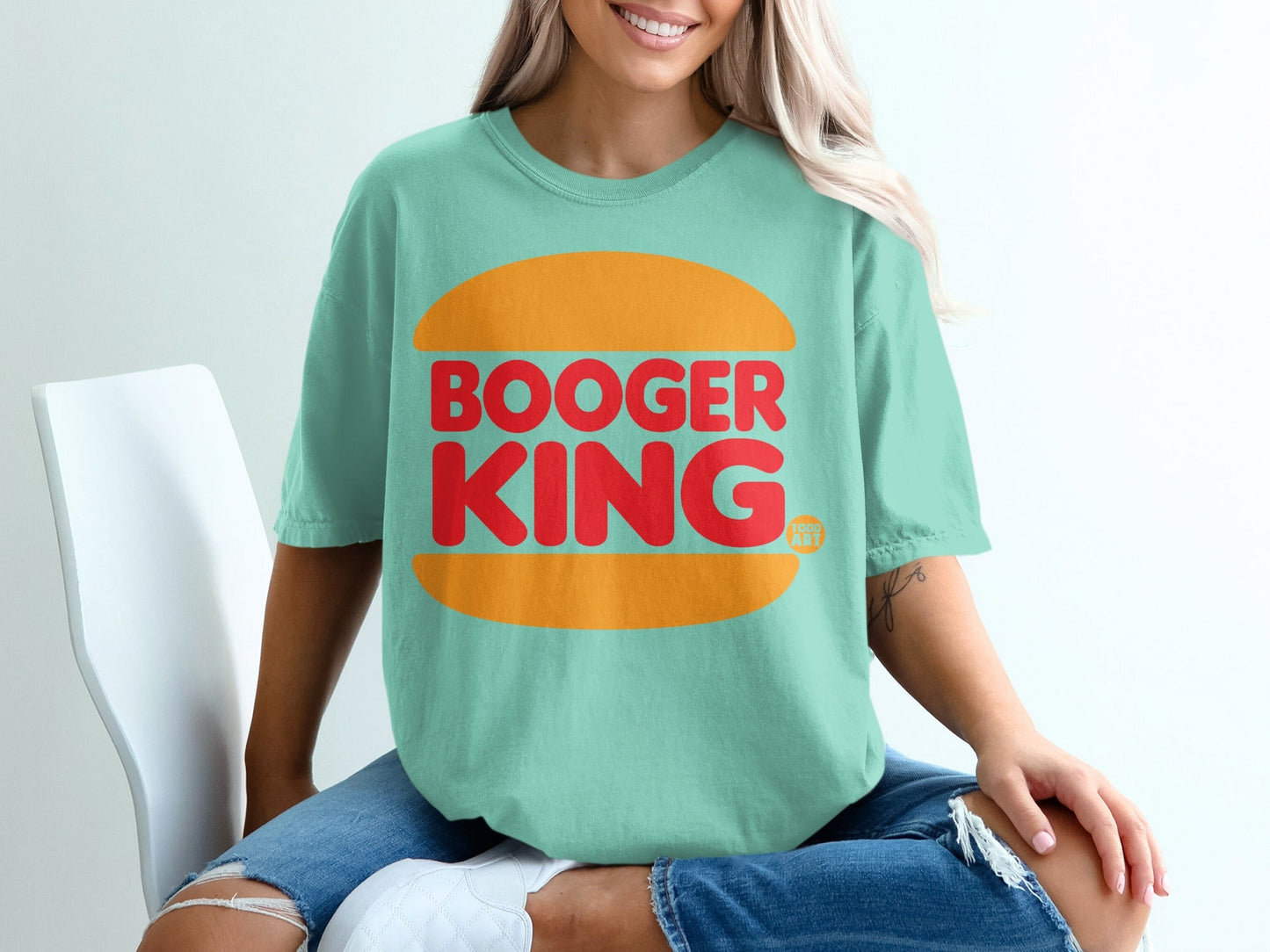 Teal t-shirt with "BOOGER KING" text inside an orange burger bun.