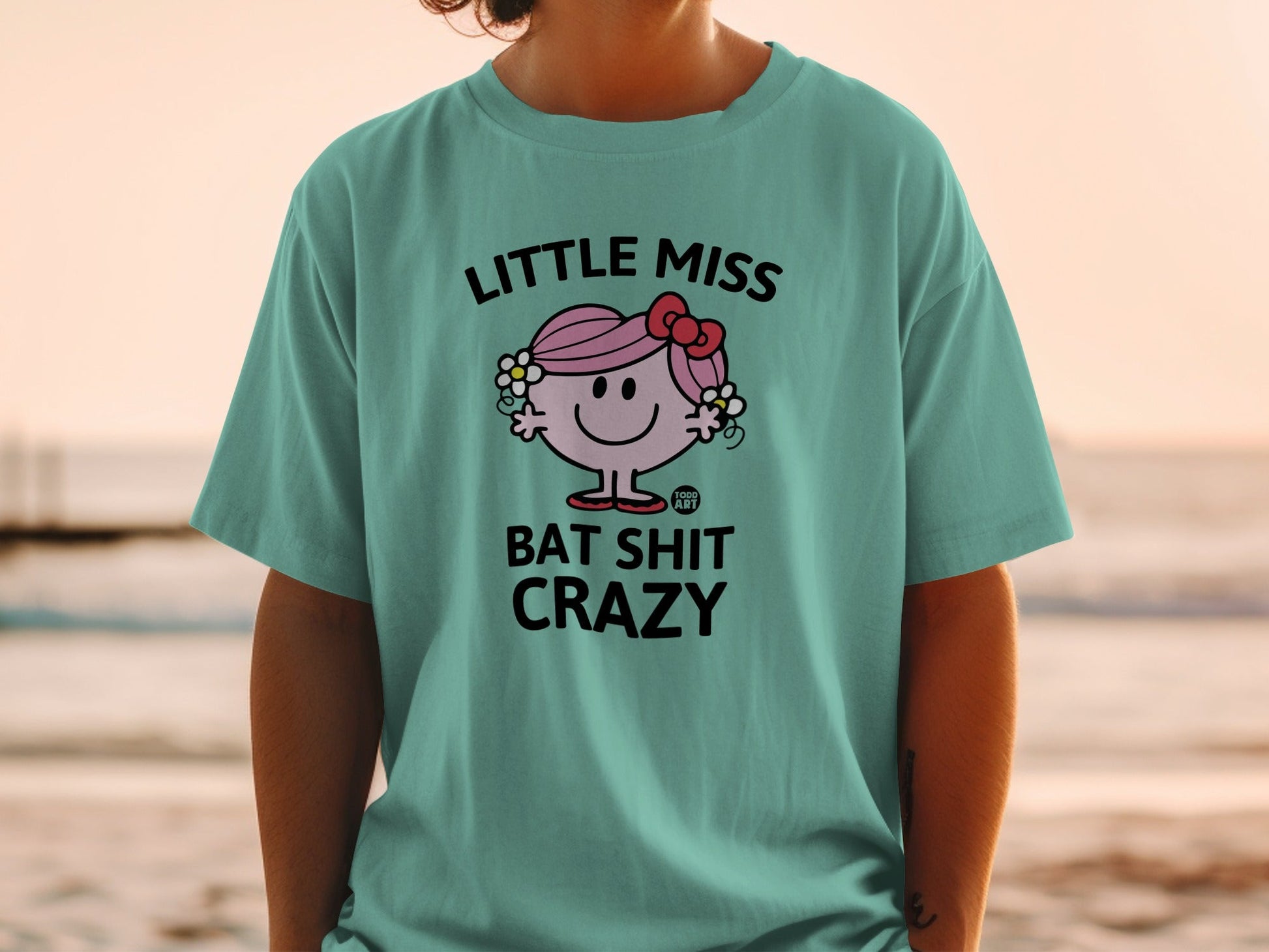T-shirt with Little Miss Bat Shit Crazy graphic and a pink bow.
