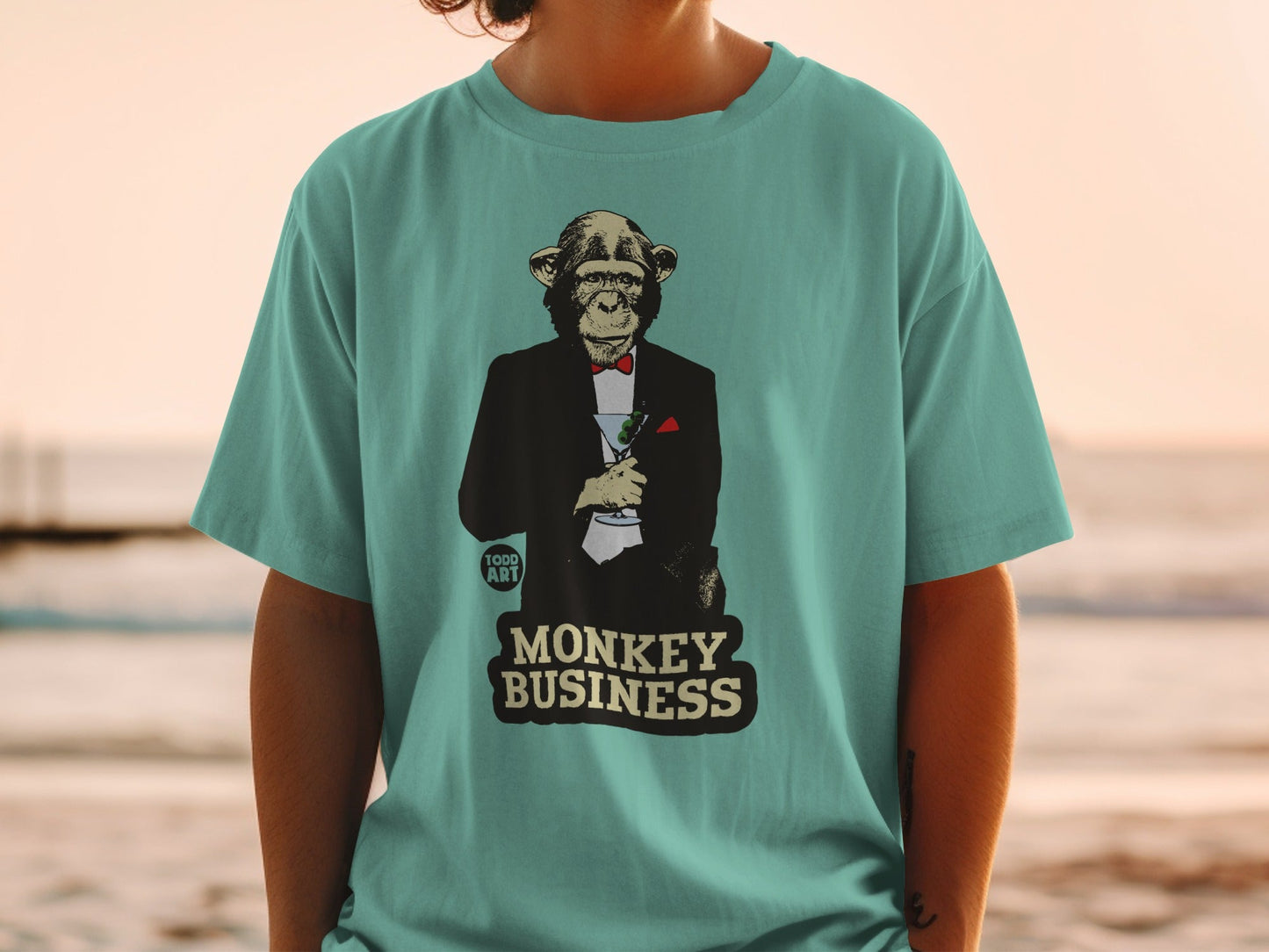 T-shirt with a monkey in a tuxedo holding a martini glass, "Monkey Business" text.