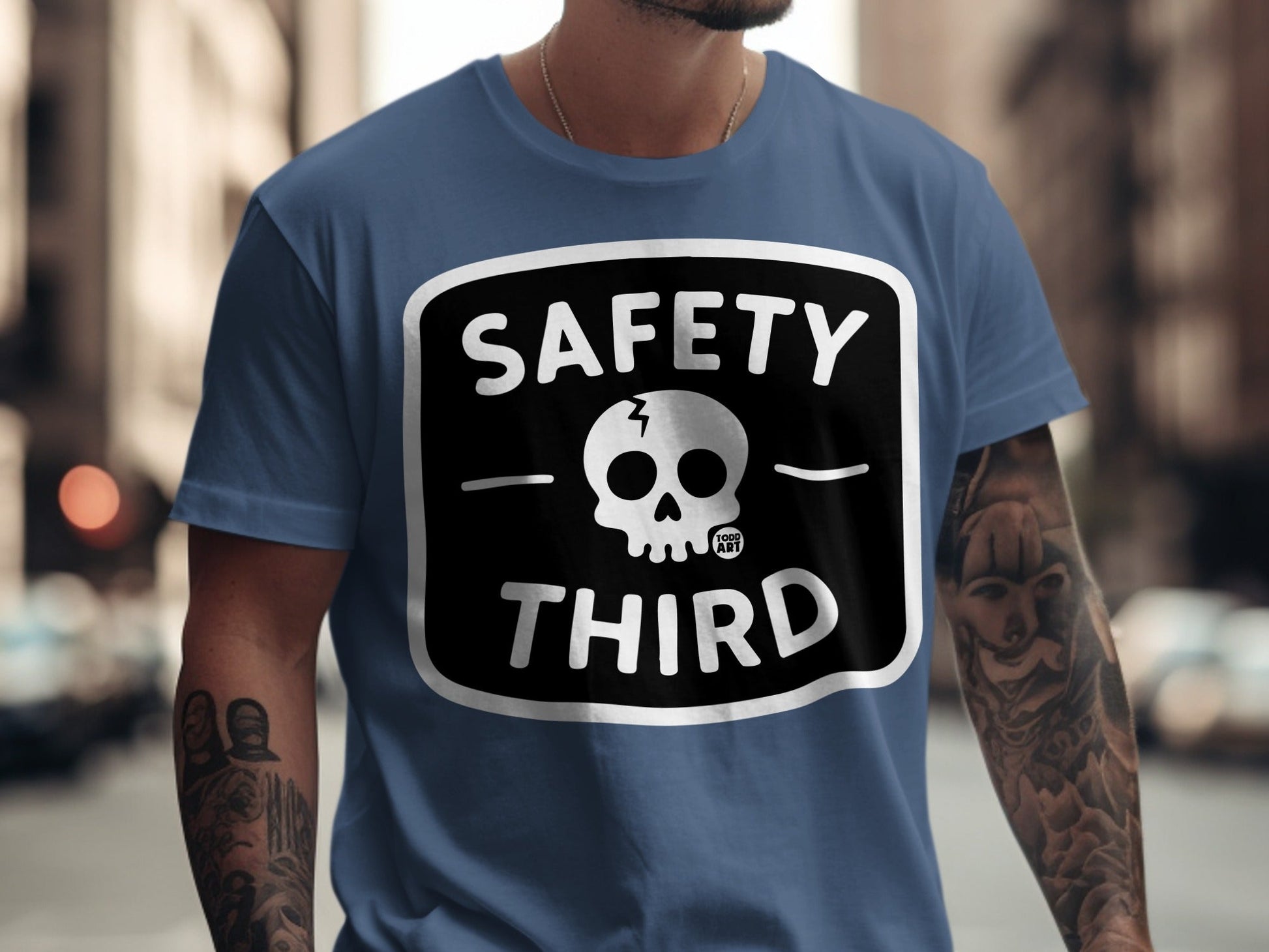 Blue t-shirt with "SAFETY THIRD" and a skull logo.