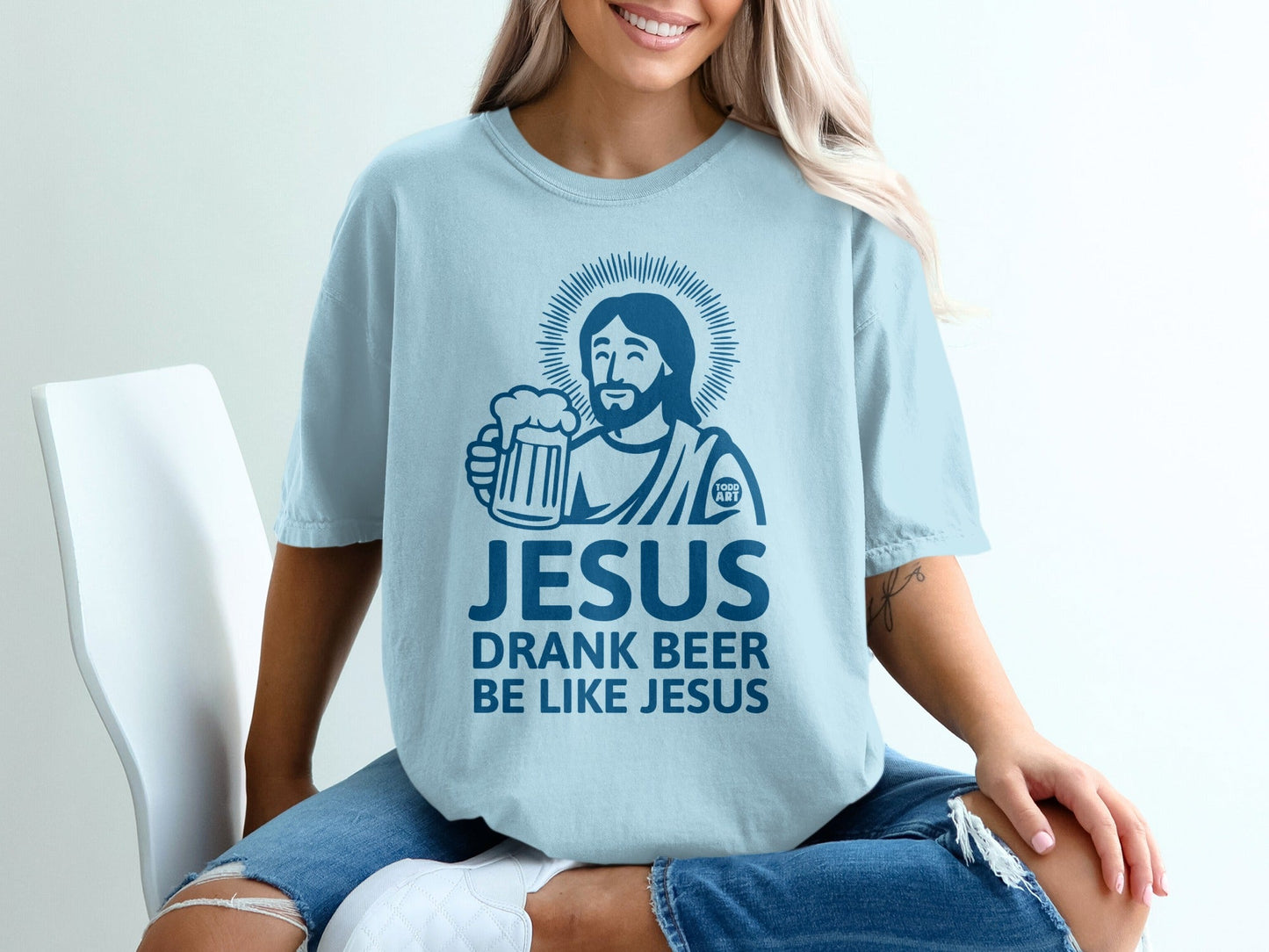 Light blue t-shirt with Jesus holding a beer, text "Jesus Drank Beer Like Jesus".