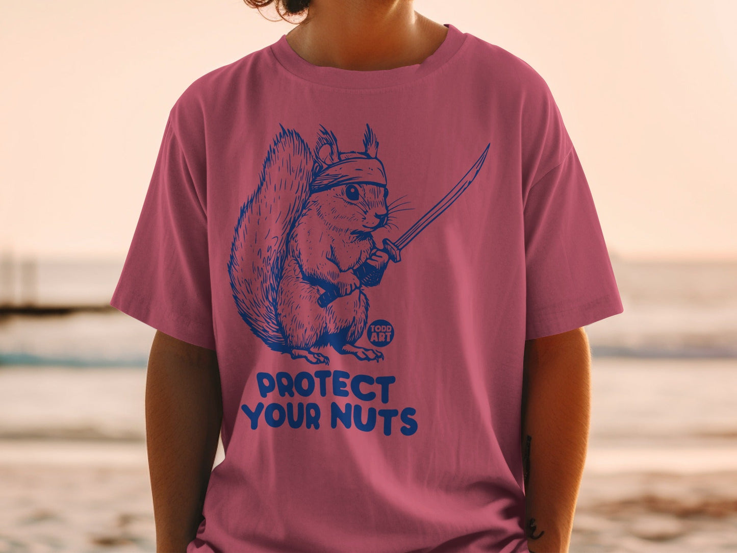 Squirrel warrior with katana on t-shirt, text "PROTECT YOUR NUTS".