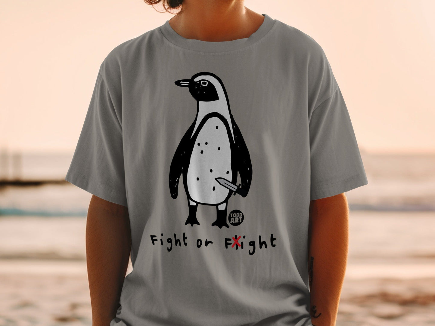 Grey t-shirt with a penguin holding a knife, text "Fight or Flight".