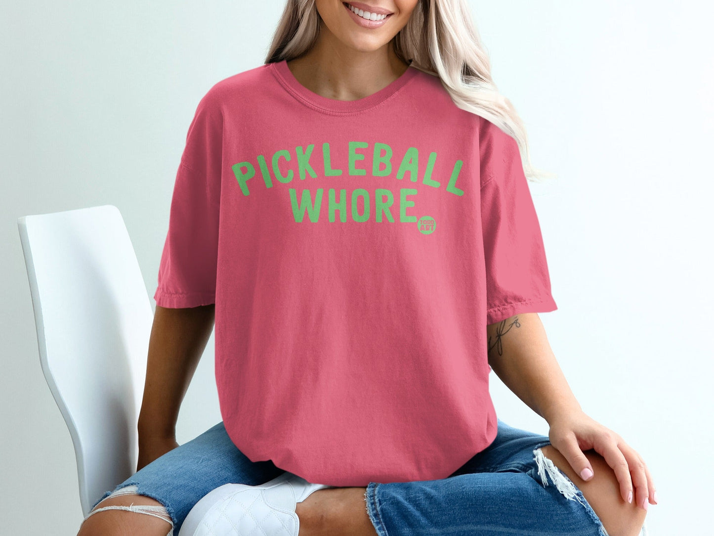 Pink t-shirt with "PICKLEBALL WHORE" text in green.