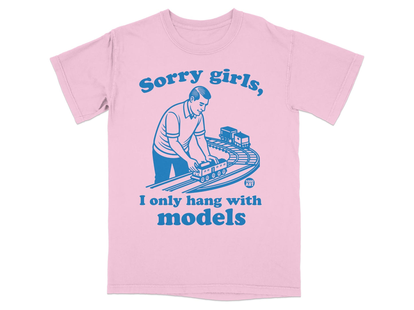 Pink t-shirt with blue text reading "Sorry girls, I only hang with models" and a graphic of a man with toy trains.