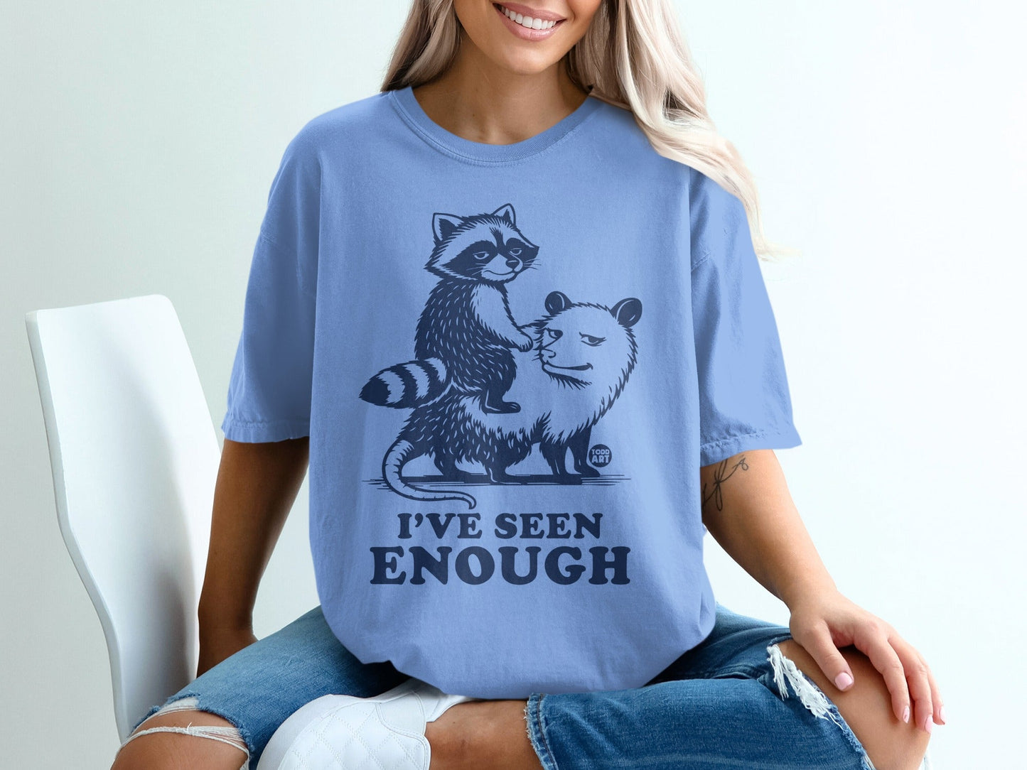 T-shirt with raccoon riding a possum, text I'VE SEEN ENOUGH.