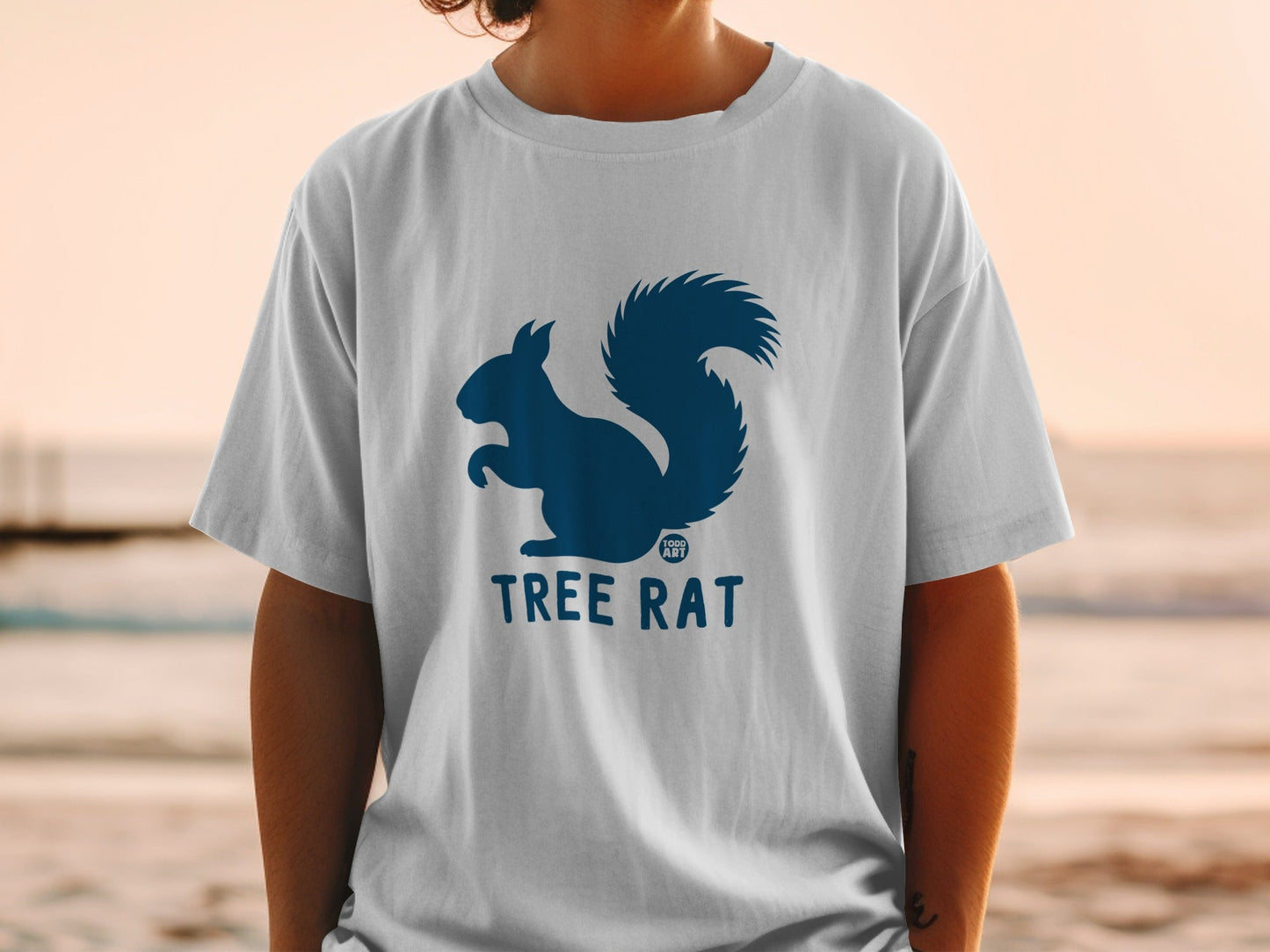 White t-shirt with dark blue squirrel logo and "TREE RAT" text.