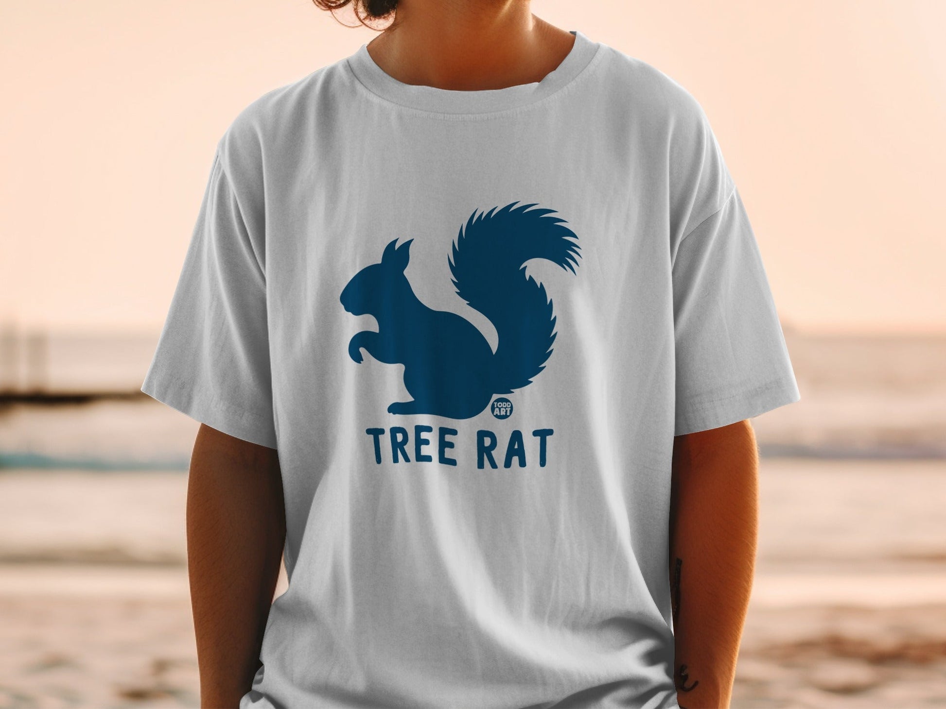 White t-shirt with dark blue squirrel logo and "TREE RAT" text.