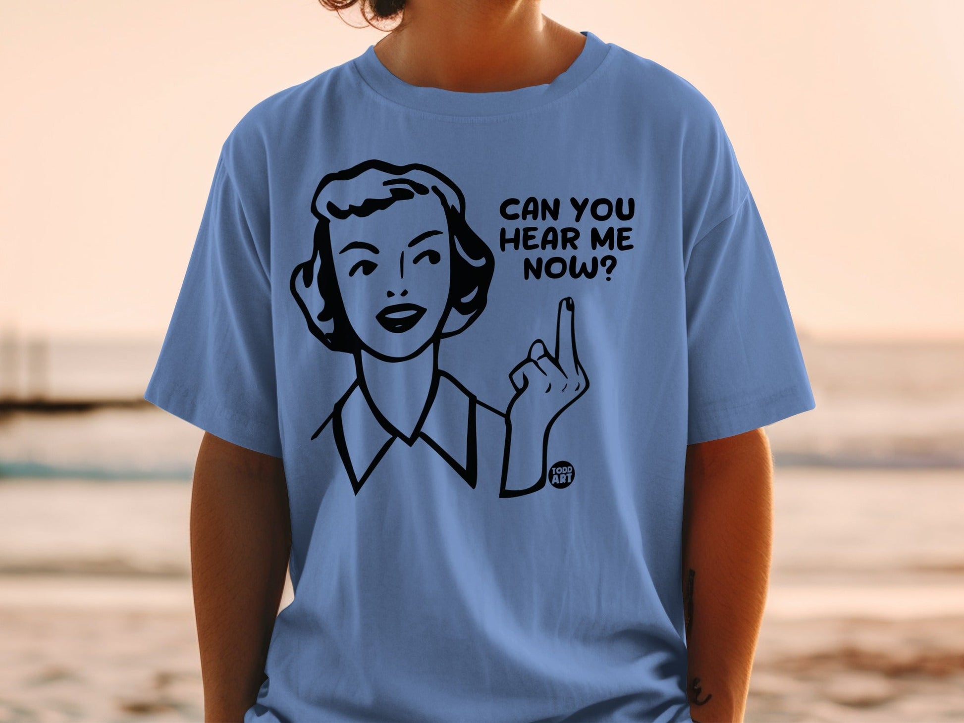 Blue t-shirt with illustration of a woman saying "Can you hear me now?"