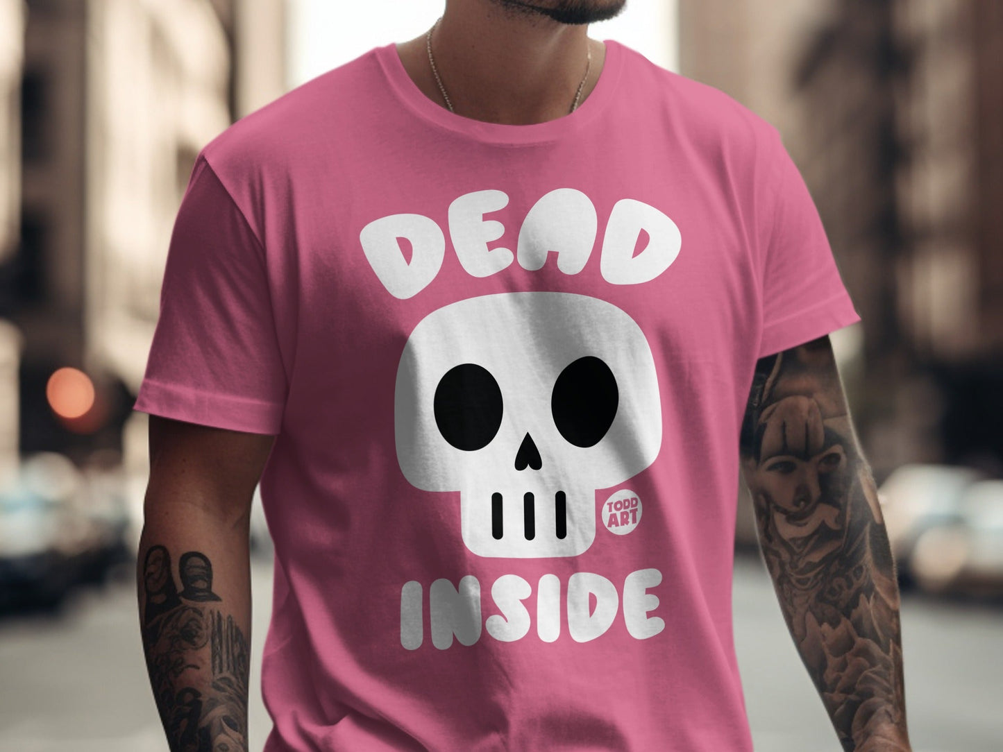 Pink t-shirt with "DEAD INSIDE" text and skull graphic.
