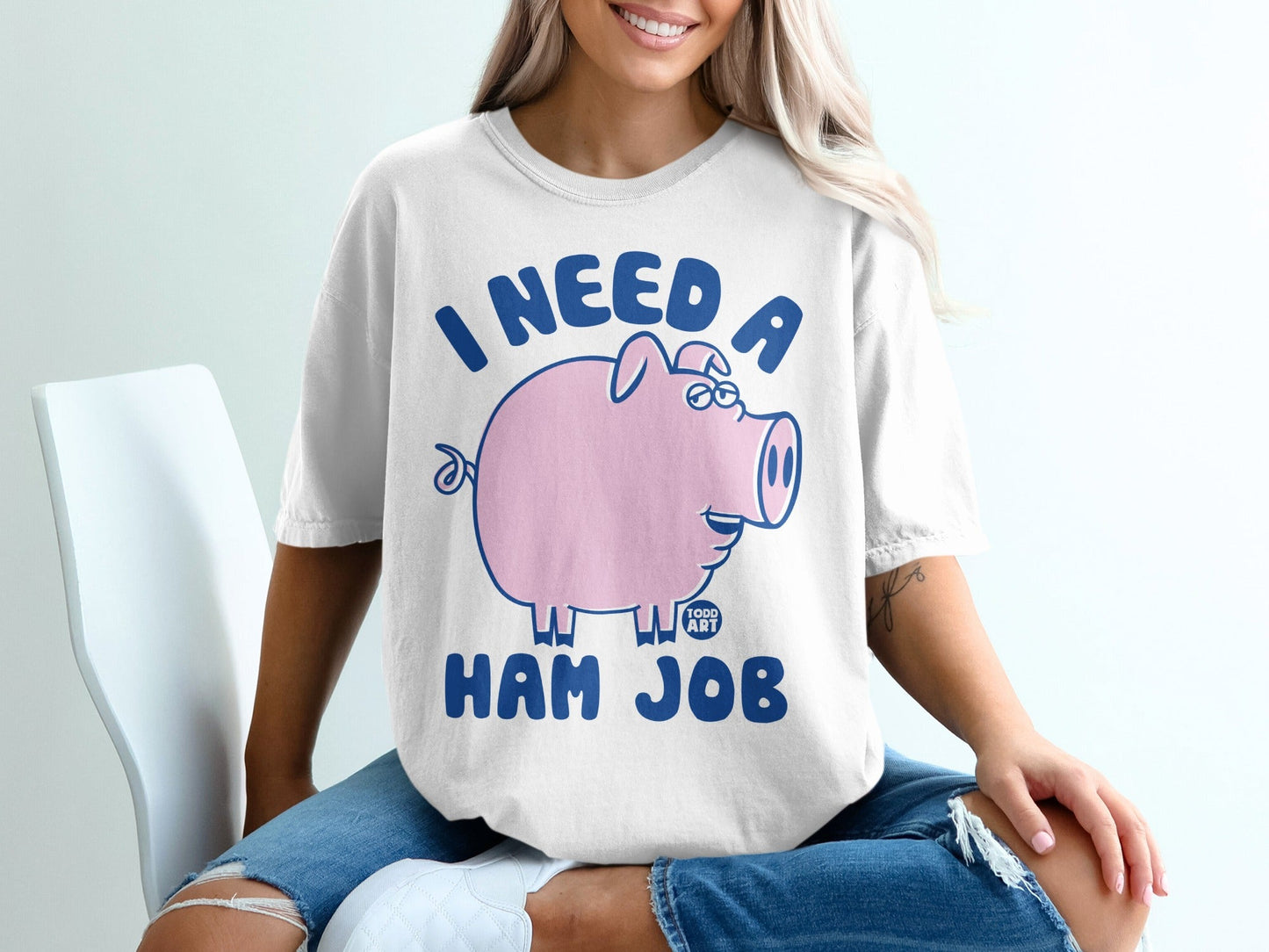 T-shirt with a cartoon pig and text "I NEED A HAM JOB".