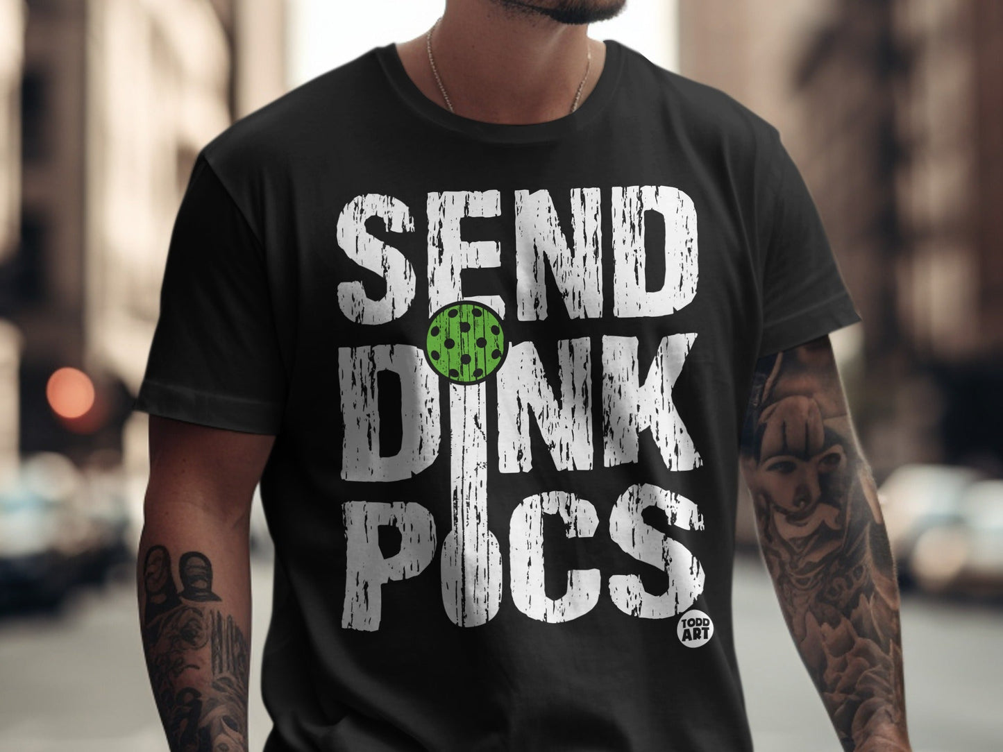 Black t-shirt with "SEND DINK PICS" and a pickleball graphic.