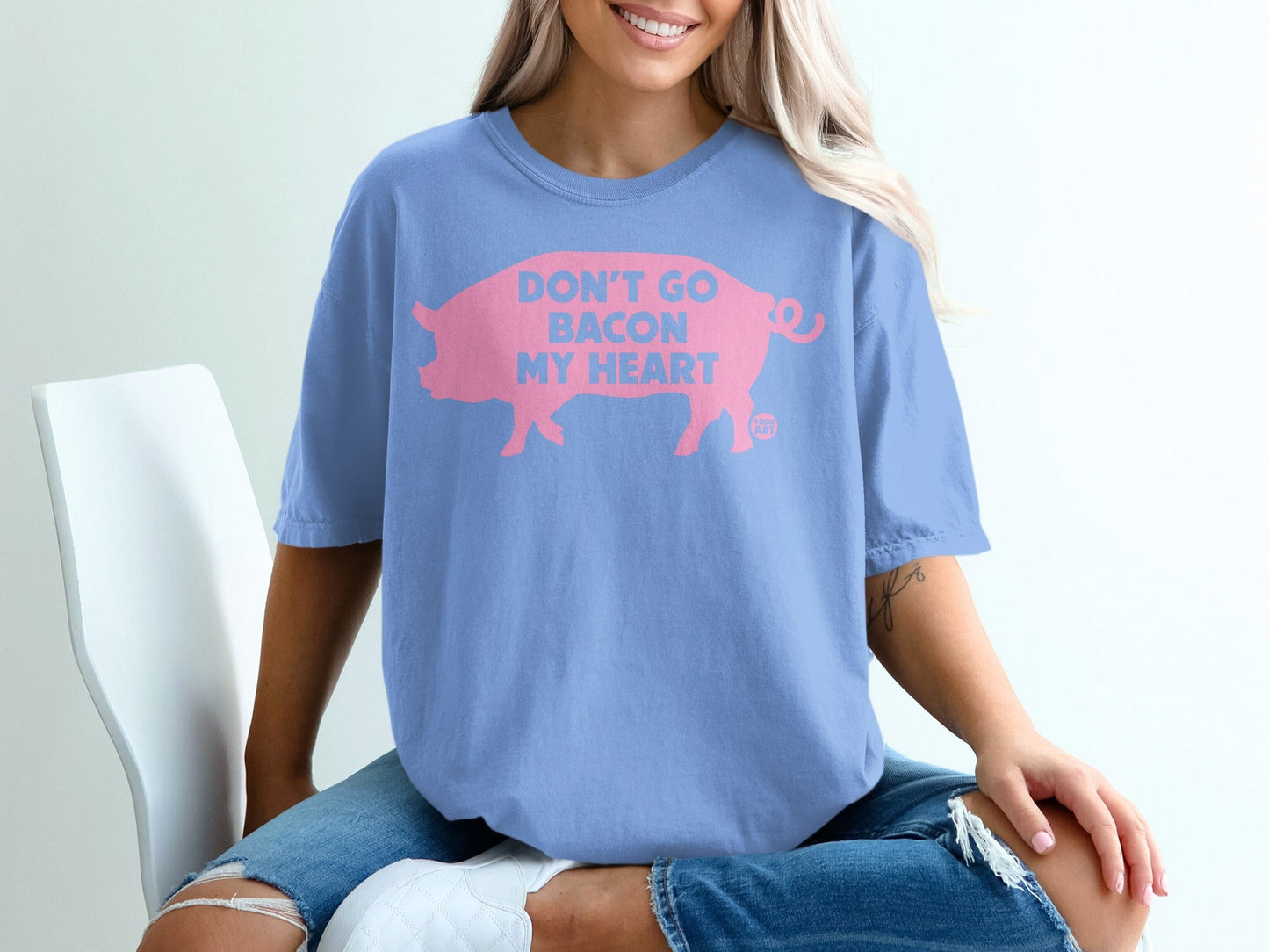 Blue t-shirt with pink pig graphic and "Don't go bacon my heart" text.
