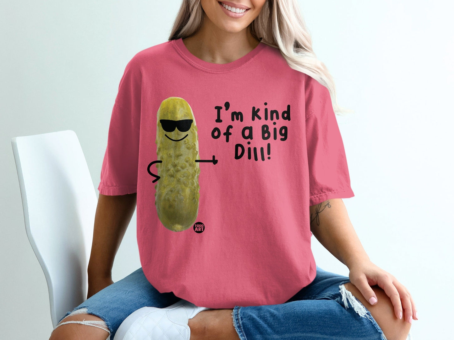 T-shirt with a cartoon pickle wearing sunglasses and text "I'm kind of a Big Dill!".