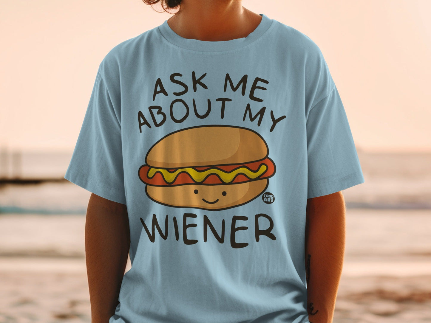 Light blue t-shirt with "Ask Me About My Wiener" and a cartoon hot dog.