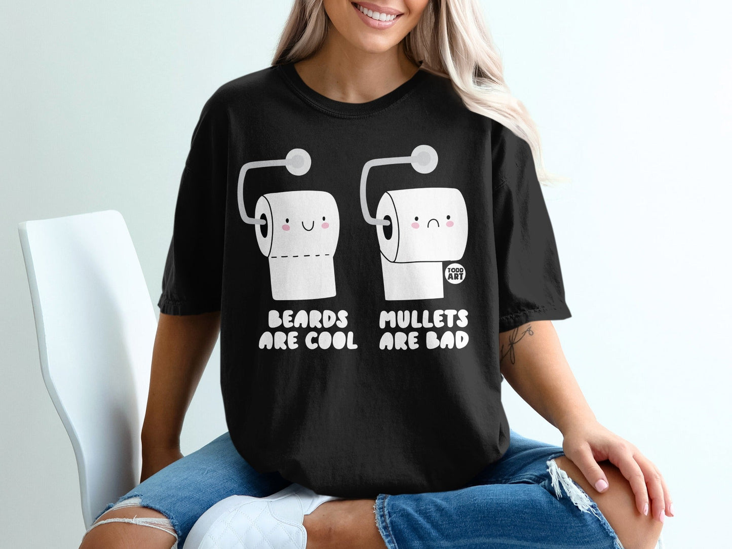 Black t-shirt with cartoon toilet paper rolls and text "BEARDS ARE COOL MULLETS ARE BAD".