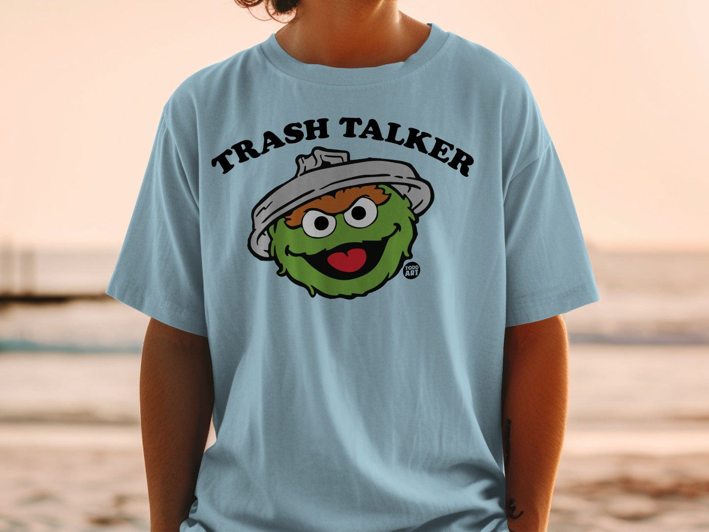 Light blue t-shirt with Oscar the Grouch, "Trash Talker" text.