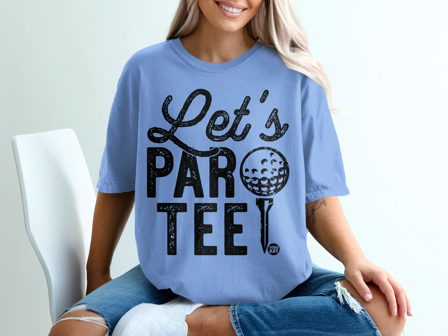 Light blue t-shirt with "Let's PAR tee" text and a golf ball and tee.