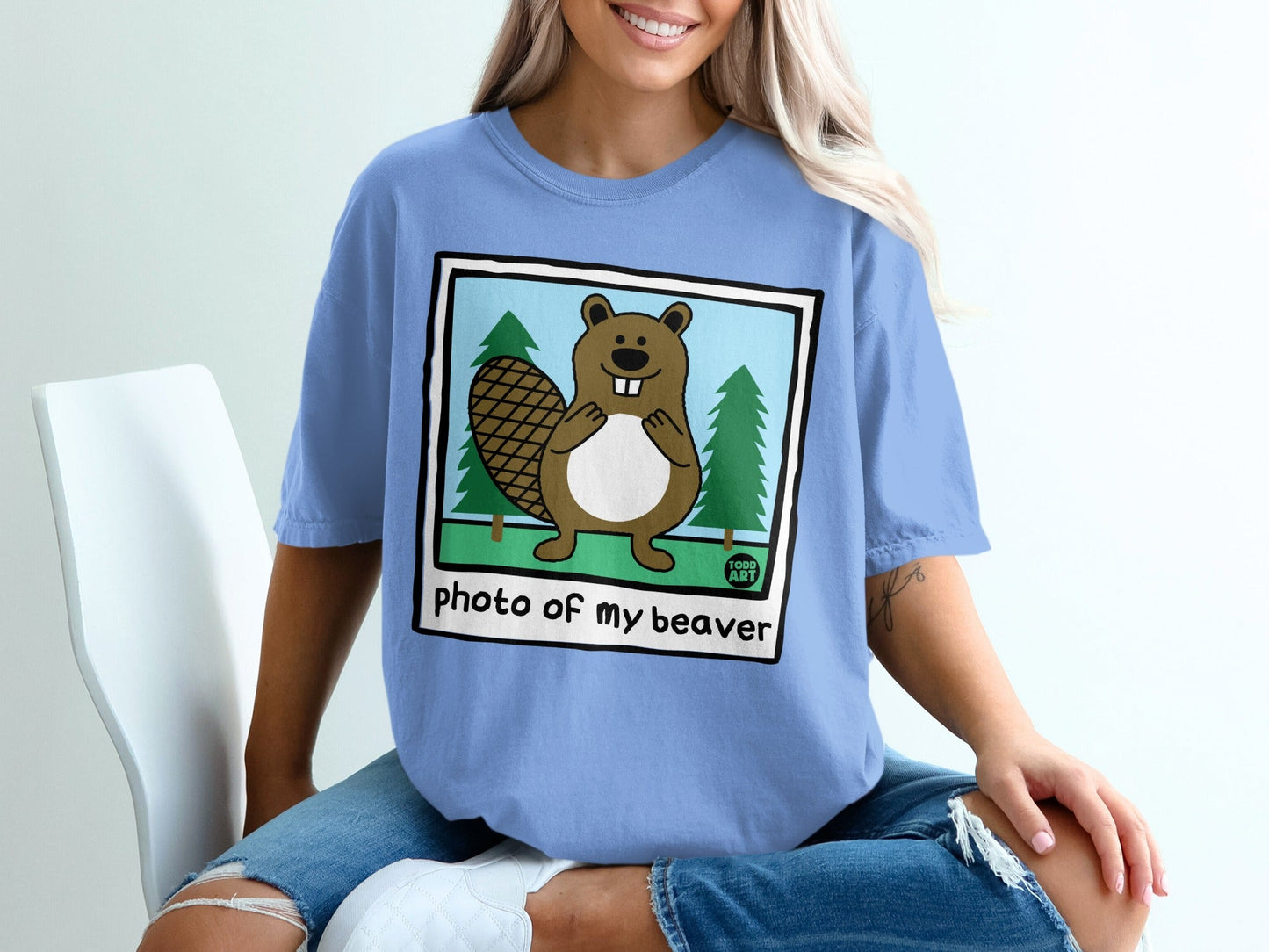 Cartoon beaver wearing a shirt that says "Photo of my beaver".