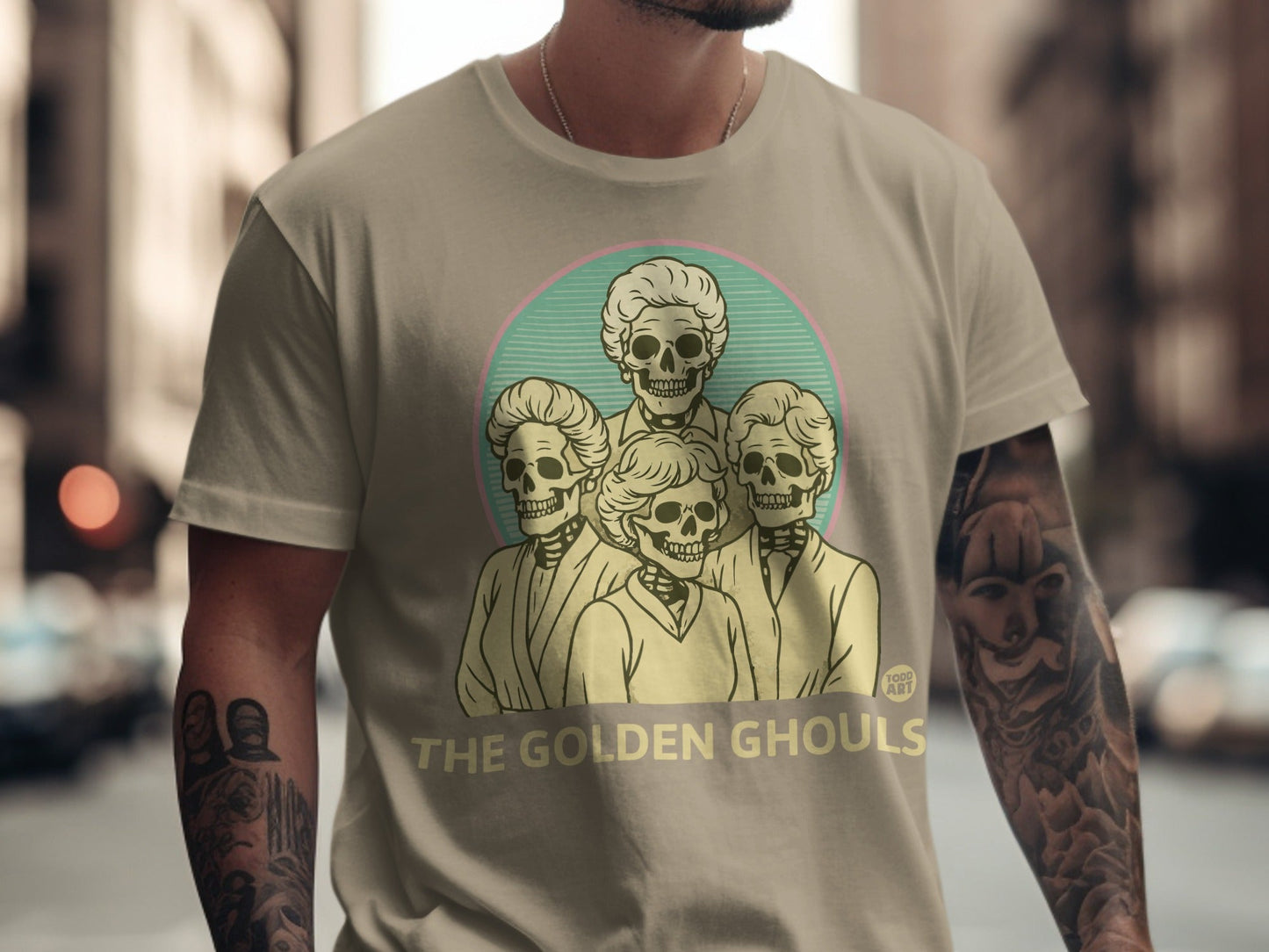 T-shirt with "The Golden Ghouls" text and a sketch of four skeletons.