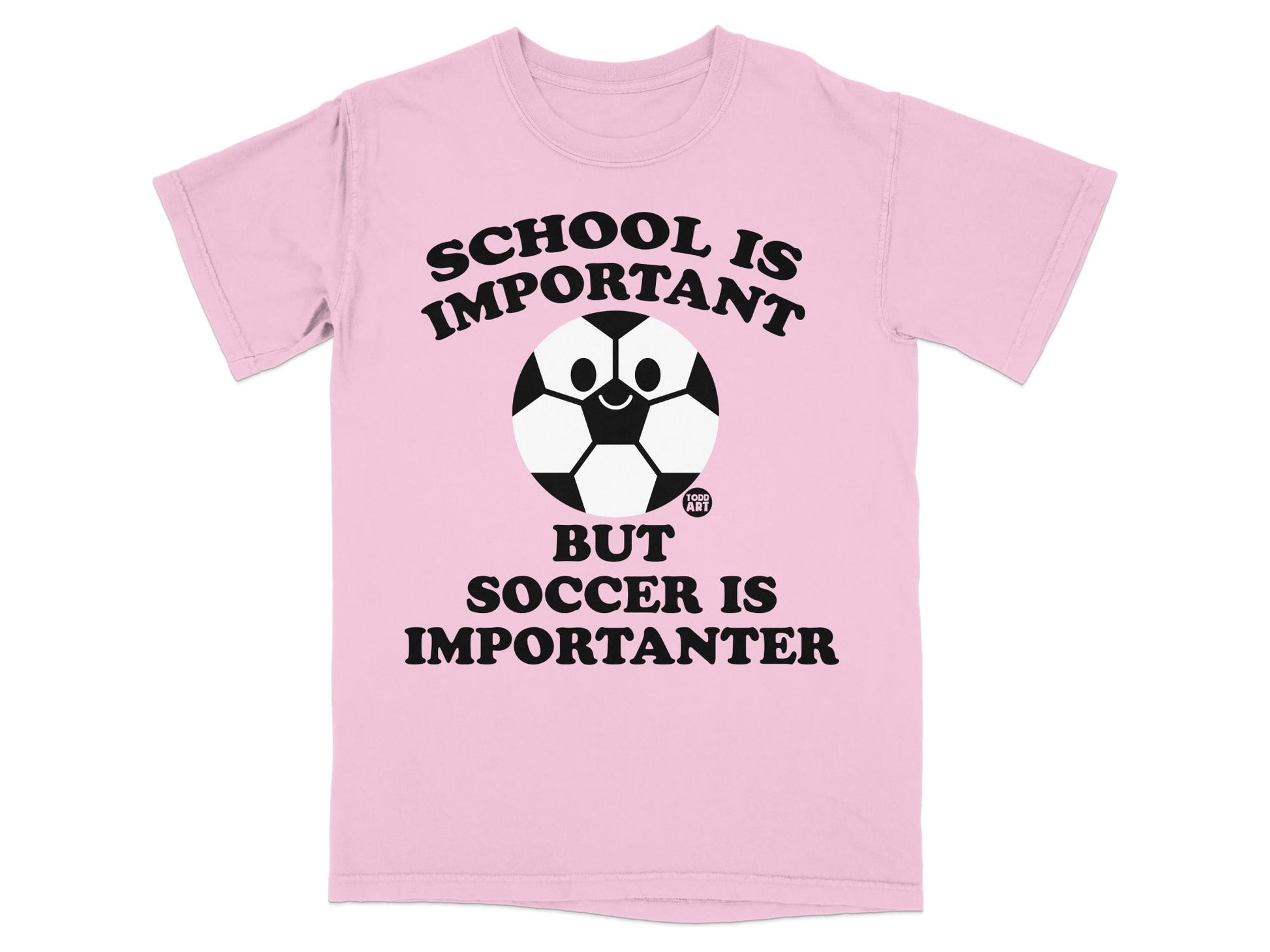 Pink t-shirt with black text and a smiling soccer ball: "SCHOOL IS IMPORTANT BUT SOCCER IS IMPORTANTER".