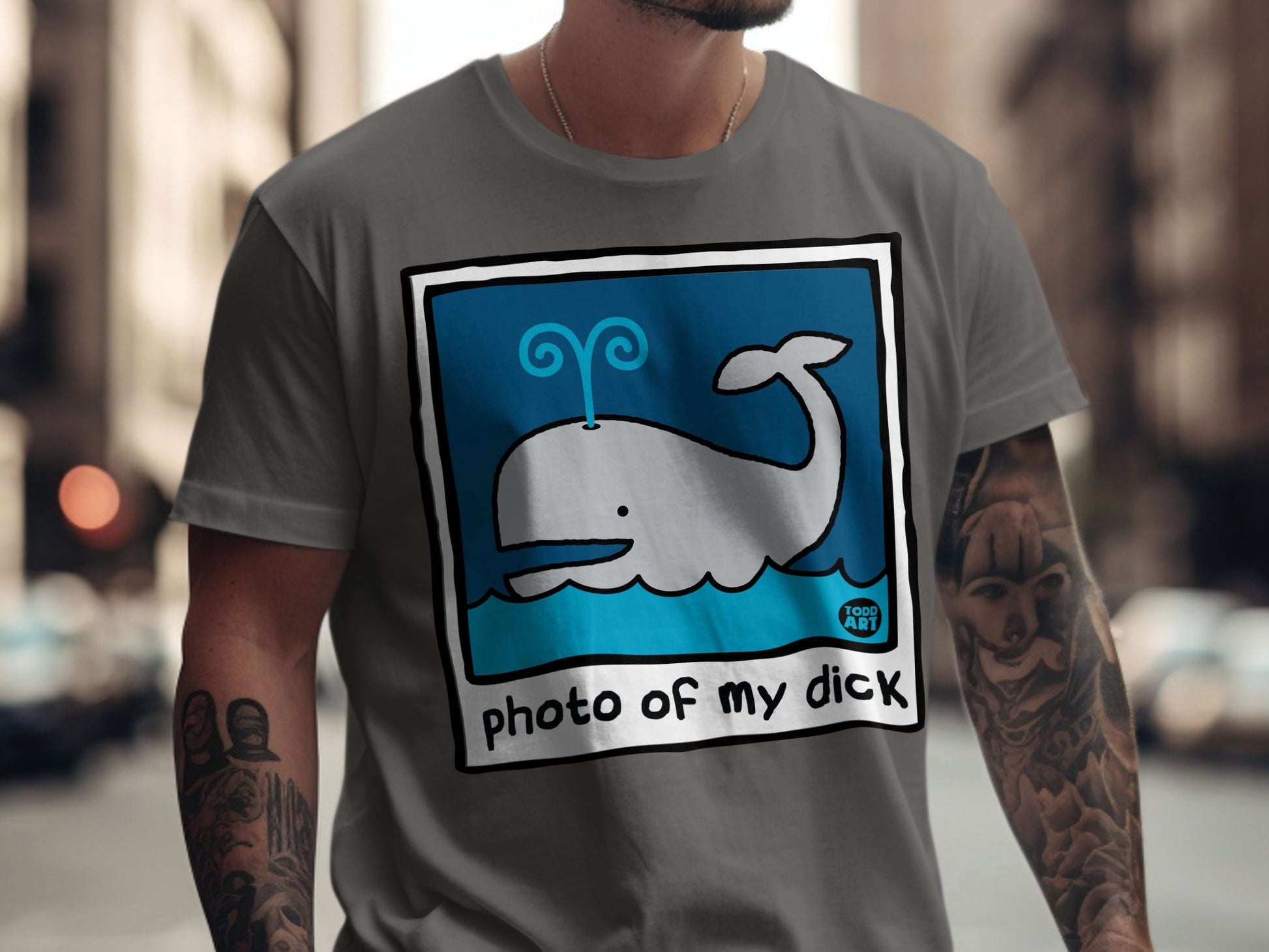 Gray t-shirt with cartoon whale graphic and "photo of my dick" text.